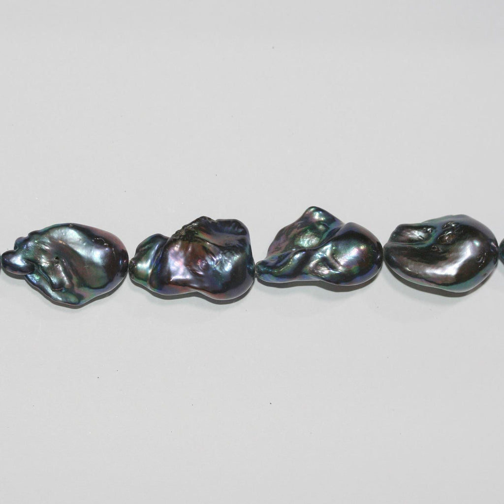 Perla Barroca Gris de Agua Dulce de 16" (24 x 15 mm). Hilo aproximado de 40 cm. Precios al por mayor.