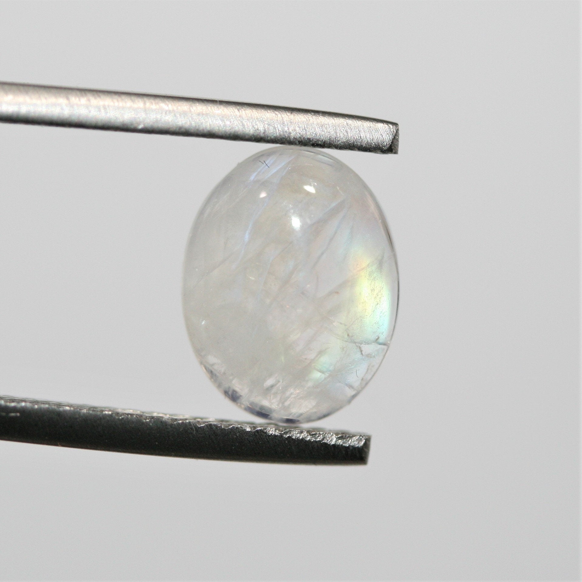 4 cabochons ovales lisses en pierre de lune 10x8mm.- (4 pièces)