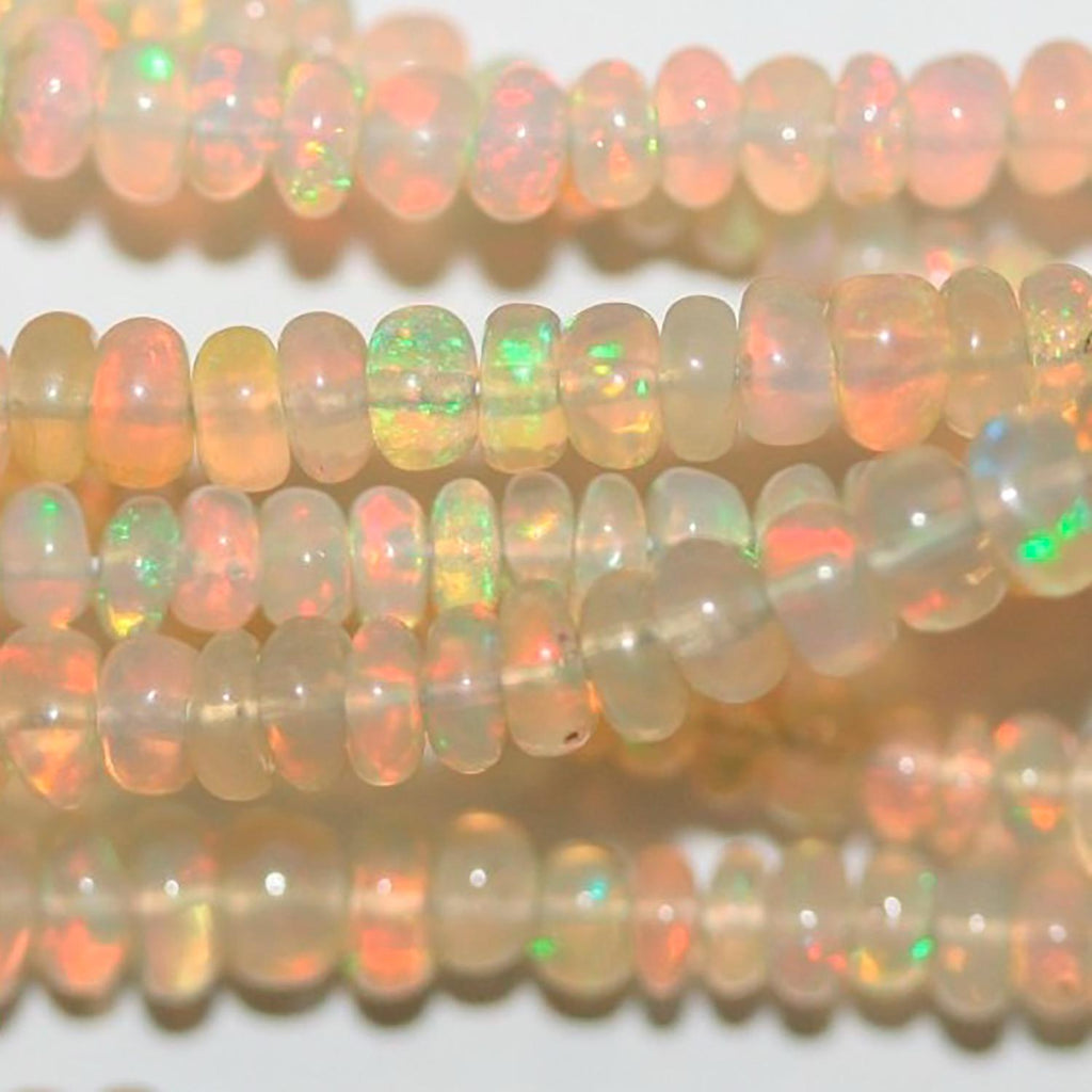 Perles rondelles lisses et graduées en opale éthiopienne, 40 cm (16 pouces), dimensions : 3 x 1,5 à 5 x 3 mm. Longueur du fil : environ 40 cm.