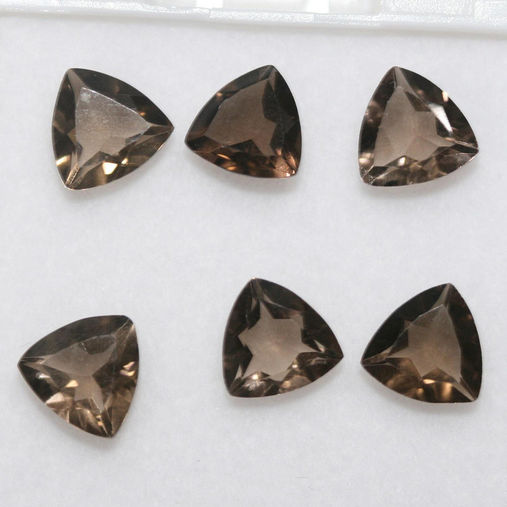 Lote de 6 trillones de cuarzo ahumado facetado de 8 mm.