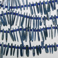 Bâtonnets de kyanite lisses et irréguliers de 15 pouces, de 13 à 23 mm environ. Longueur du brin : 39 cm.
