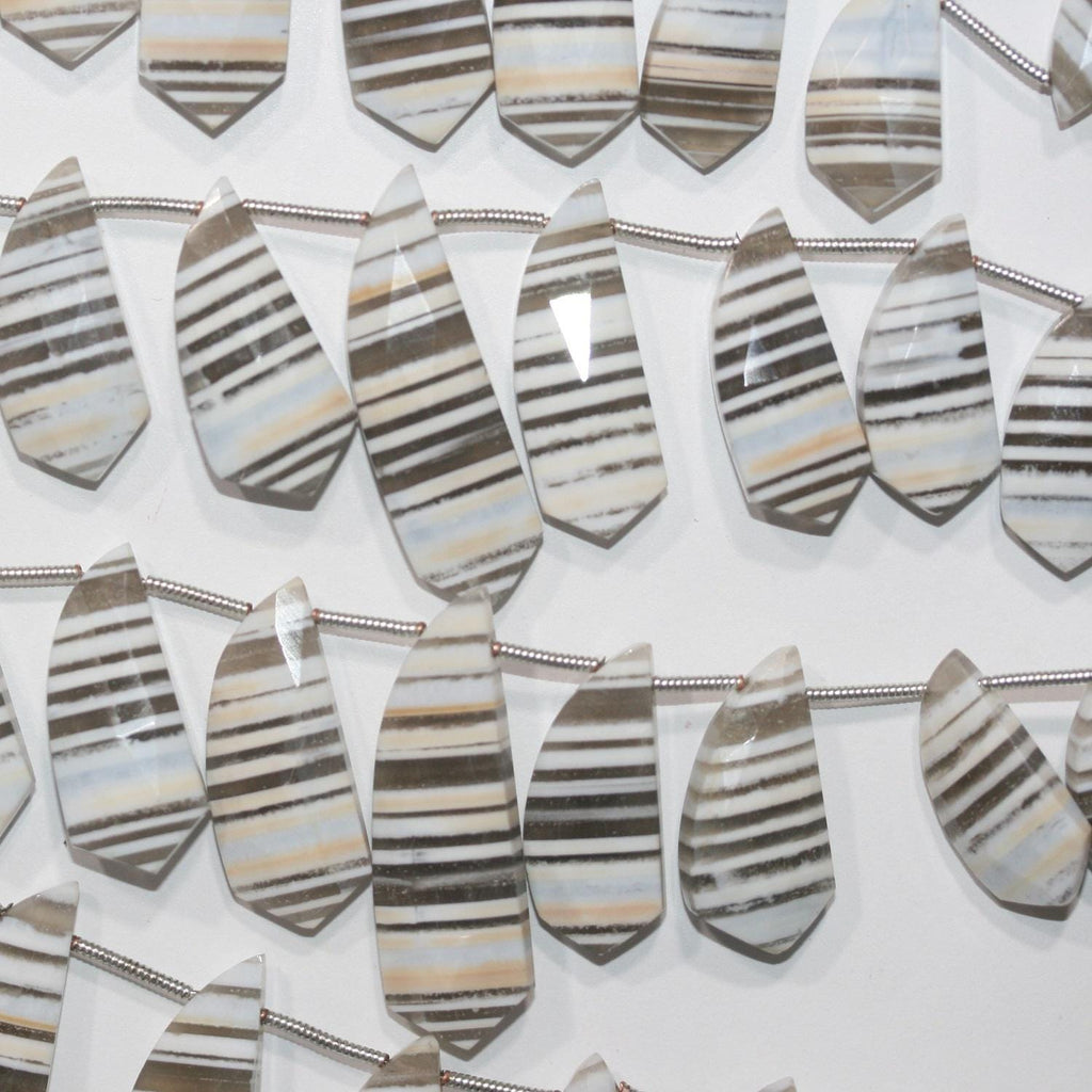 Cuentas de ópalo azul de 8" con facetas degradadas, 32 x 10 mm (aprox.) - 13,5 x 8 mm (tira de 20 cm). Artículo 14949