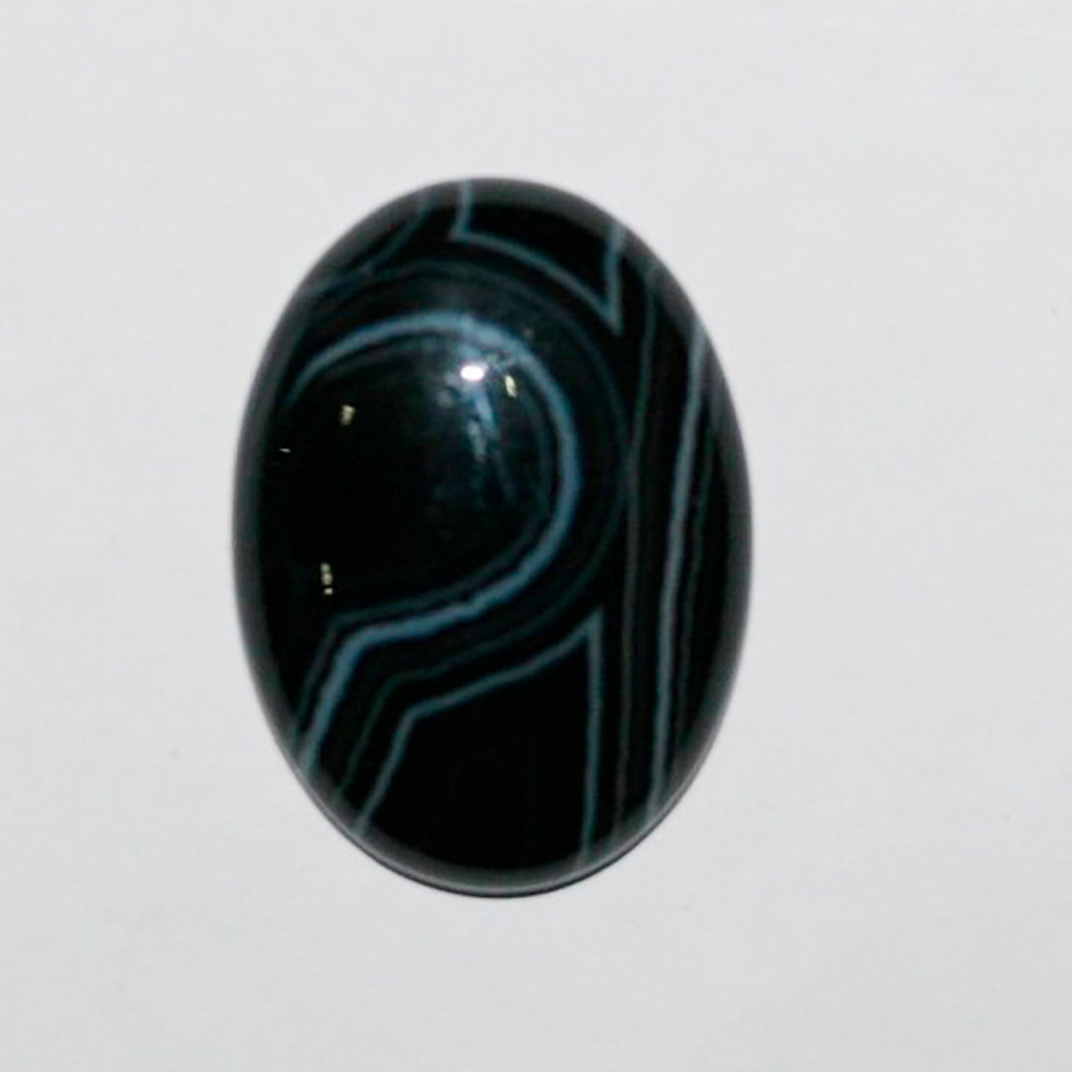 Lote de 2 cabujones ovalados de ónix blanco rayado de 30 x 22 mm. (2 piezas)