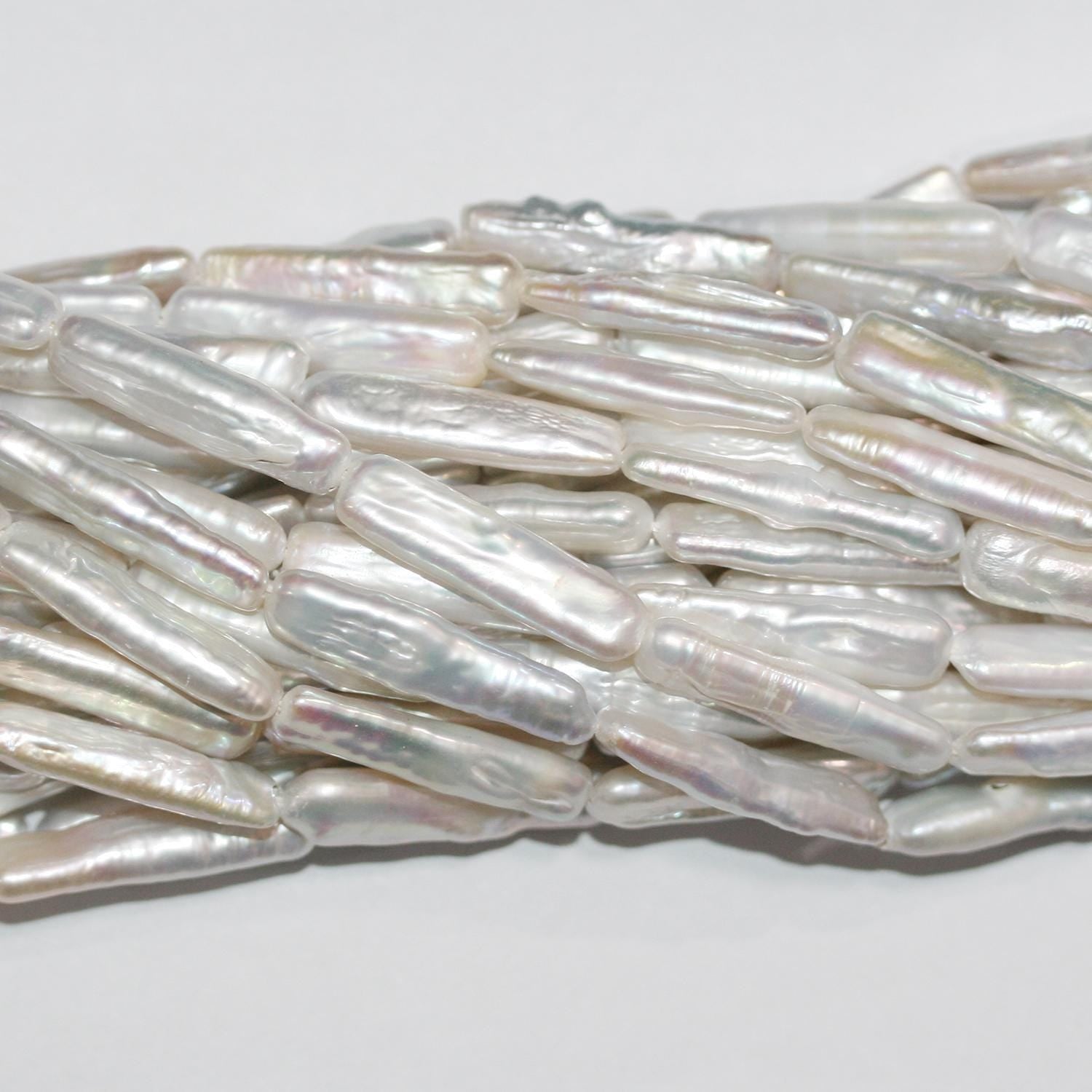 Perla Biwas de agua dulce de 16" (aprox. 24 x 5 mm) - Hilo de 40 cm - Precios al por mayor de perlas naturales