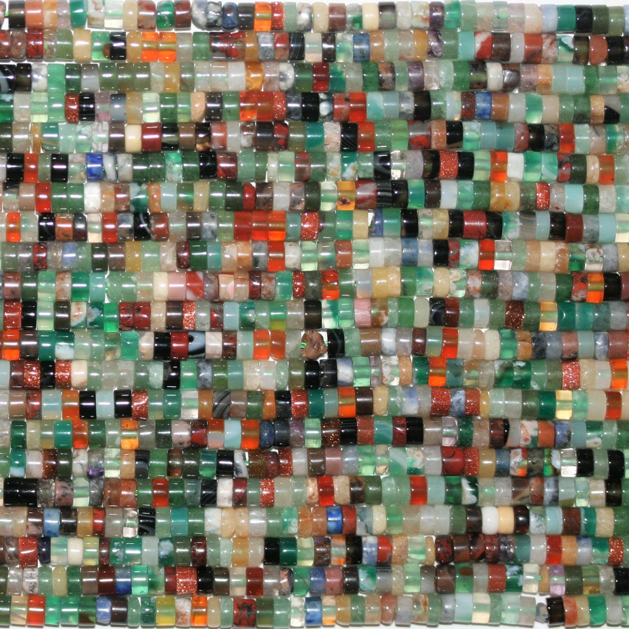 Perles disques lisses en pierre multicolore 15" 4x2mm.- Brin 39cm.