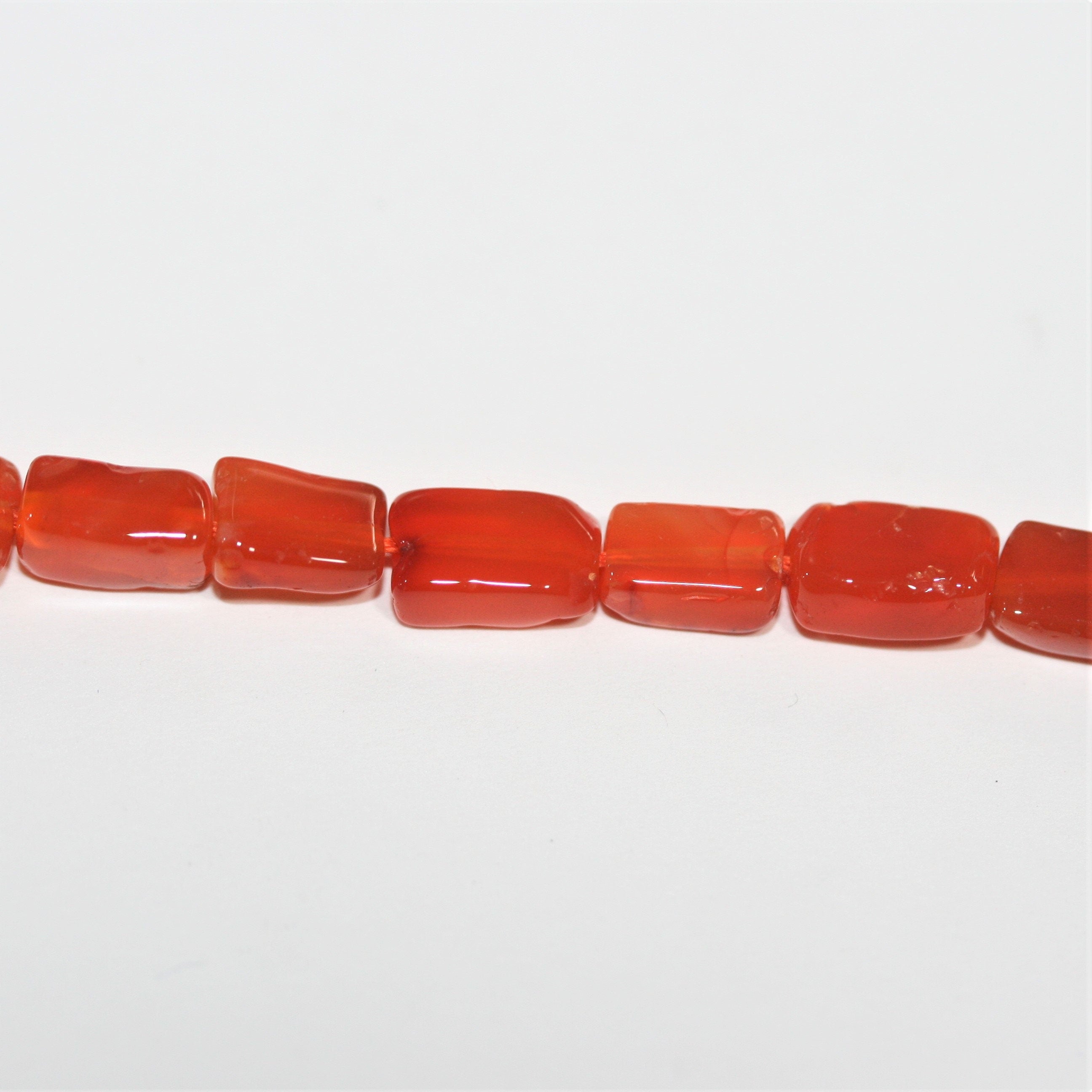 14" St Carnelian Smooth Prism Beads 7x5mm. Approx.- Strand 36cm.