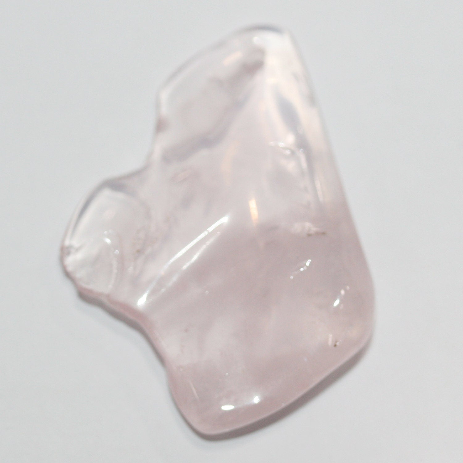 Pendentif irrégulier en quartz rose brut, environ 45 x 30 mm (1 pièce).