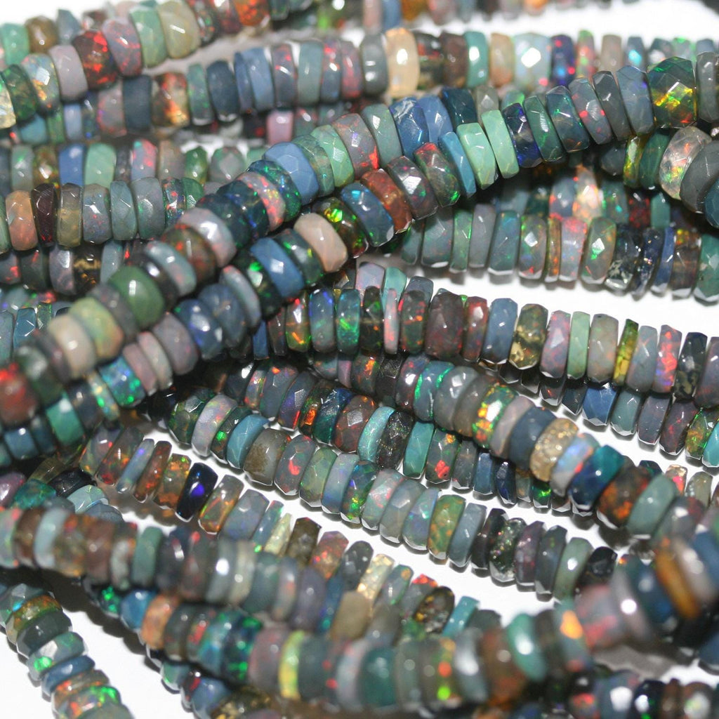 Cuentas redondas facetadas de ópalo etíope negro de 40 cm. 8,5 x 3 mm - 4 x 2 mm. Hilo de 40 cm.