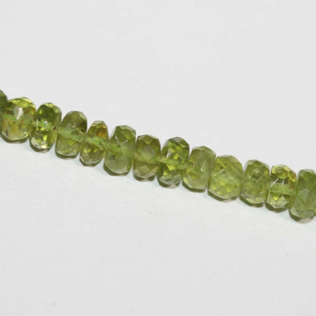 13" St Peridot Faceted Rondelle Beads 6x3.5mm.-Strand 33cm.