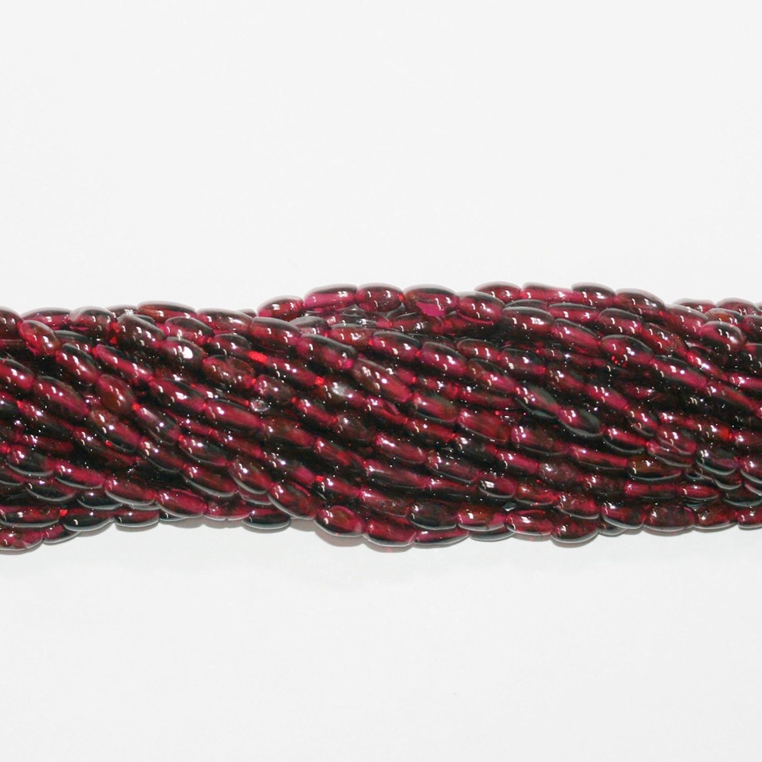 14" St Garnet Smooth Barrel Beads 6x3mm.-Strand 38cm