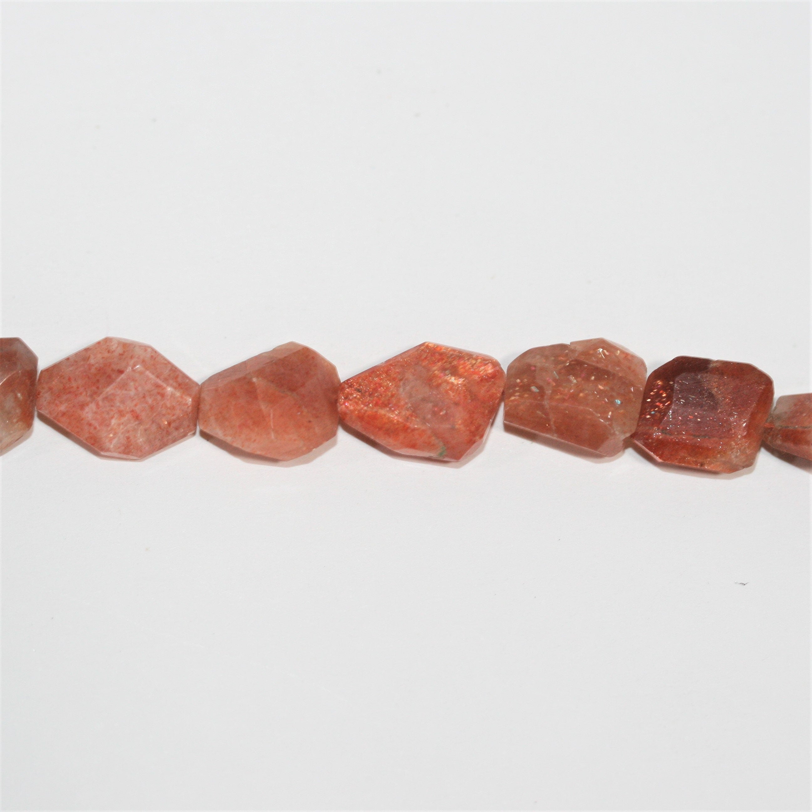 13" St Sun Stone Faceted Nugget Beads 10-15mm. Approx.- Strand 33cm.