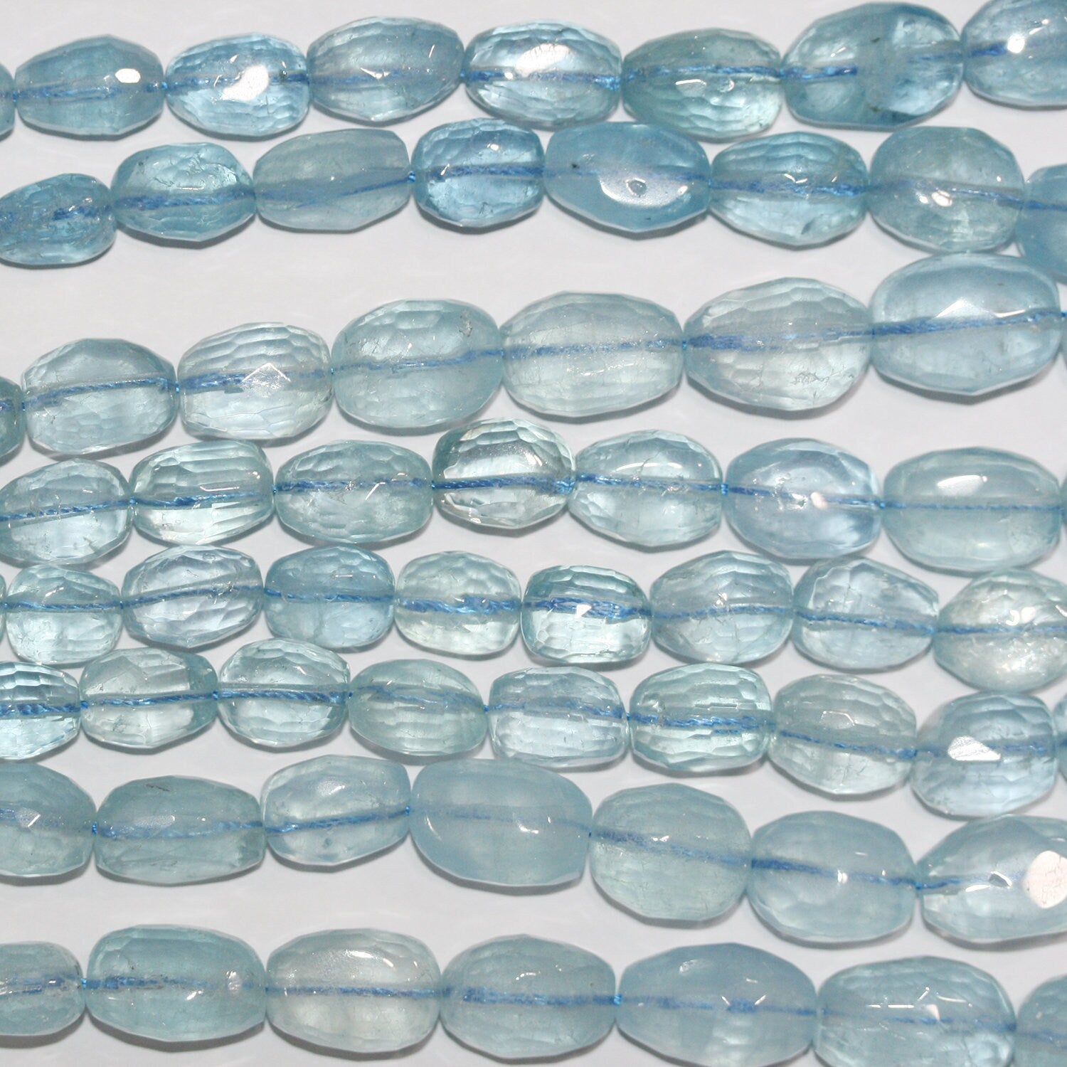 Cuentas de aguamarina de 43 cm (17"), facetadas y graduadas, de barril, 10 x 7-19 x 13 mm (aprox. - Hilo de 44 cm)