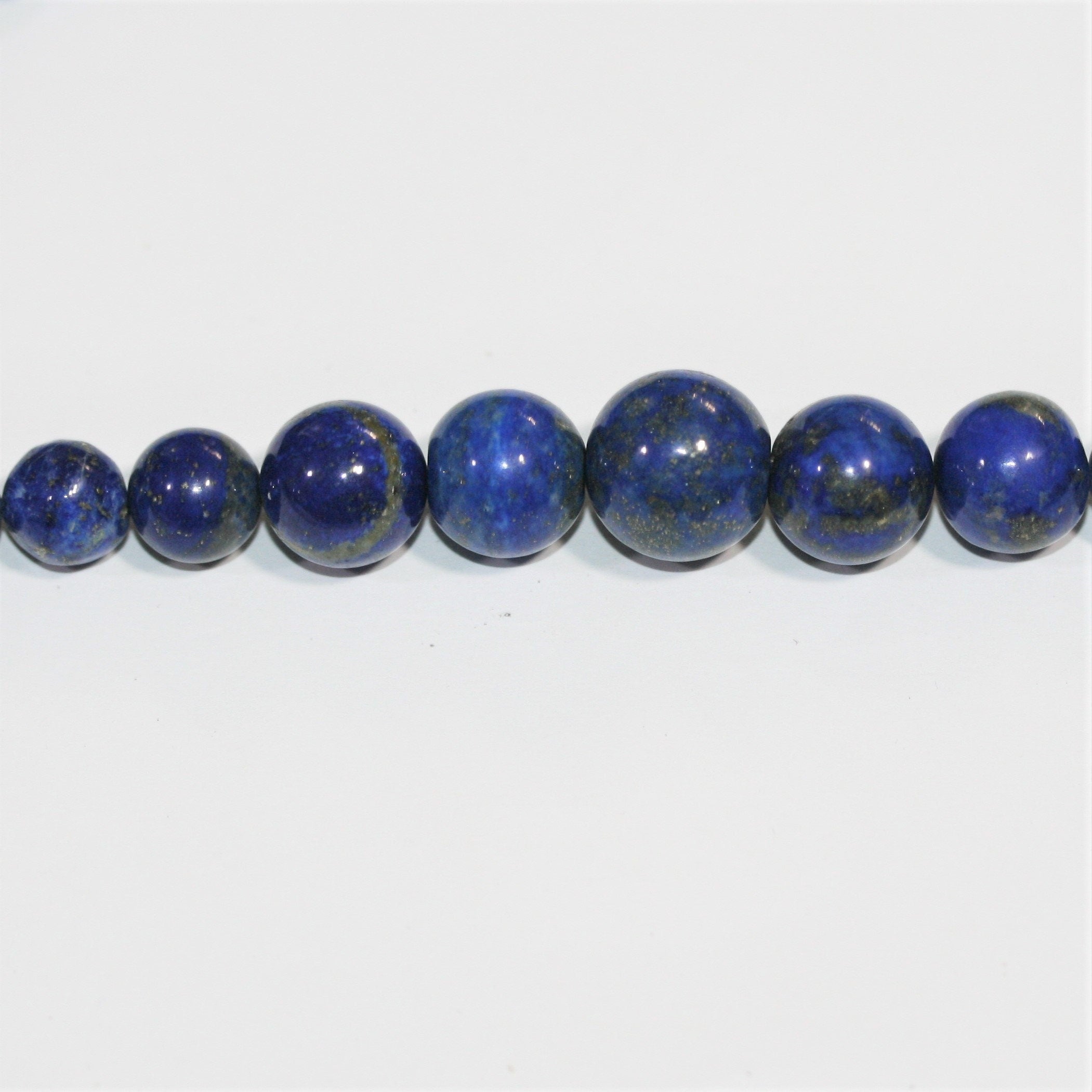 Cuentas redondas lisas graduadas de lapislázuli de 16", 5-11 mm. Aprox. - Hilo de 42 cm.
