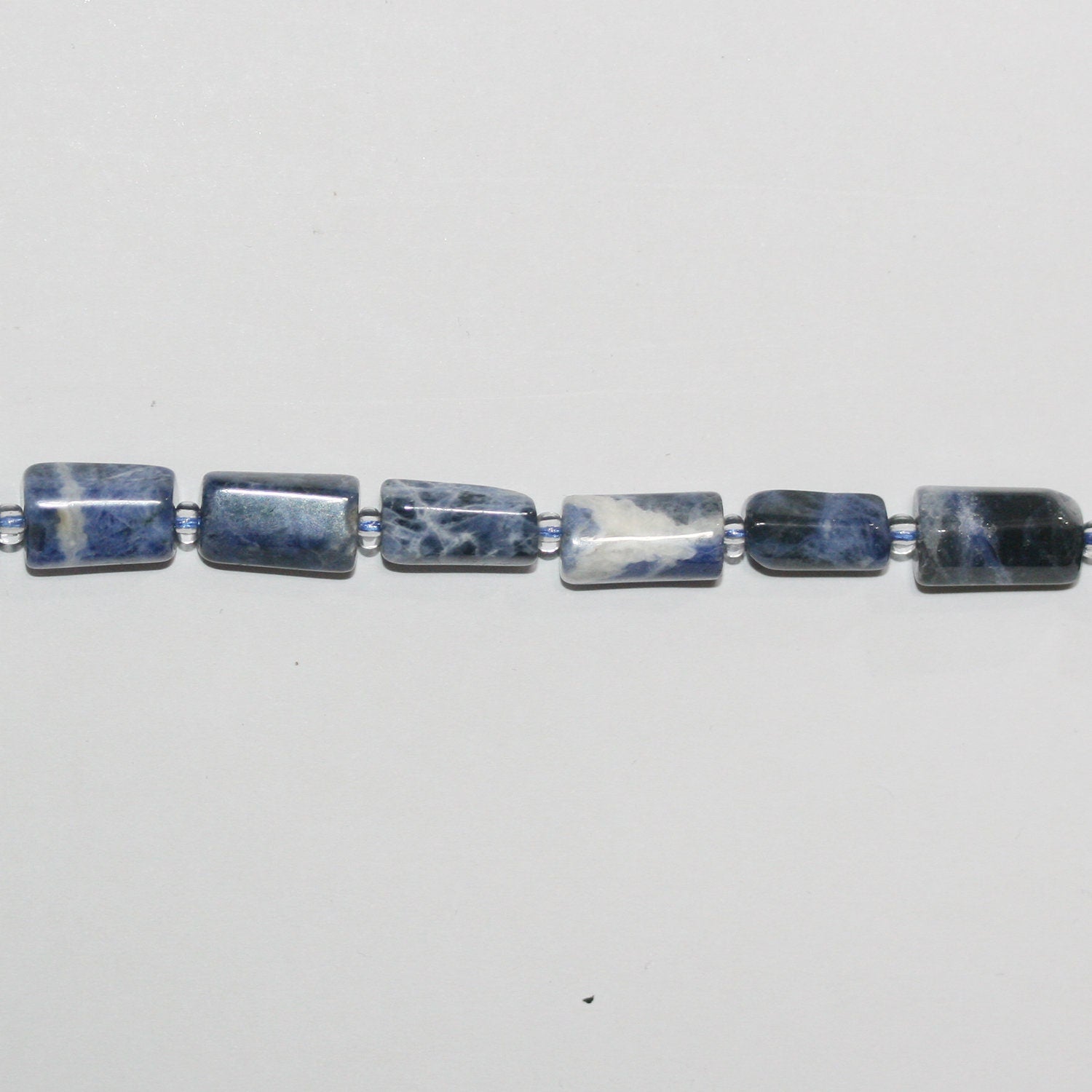 Cuentas de barril lisas de sodalita de 16", 12 x 6 mm. Aprox. - Hilo de 40 cm.