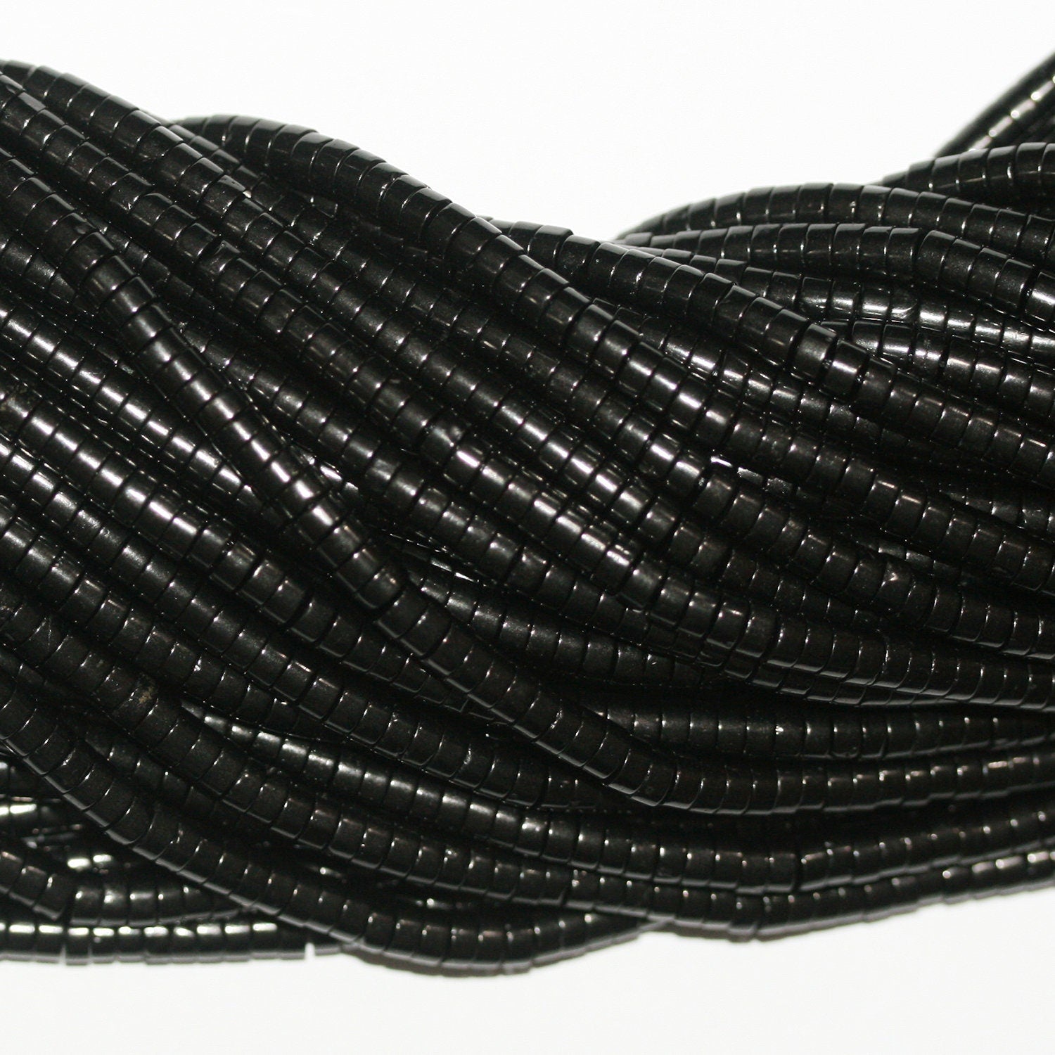 Perles disques lisses St Jet 15" 4x2mm.-Bande 39cm.