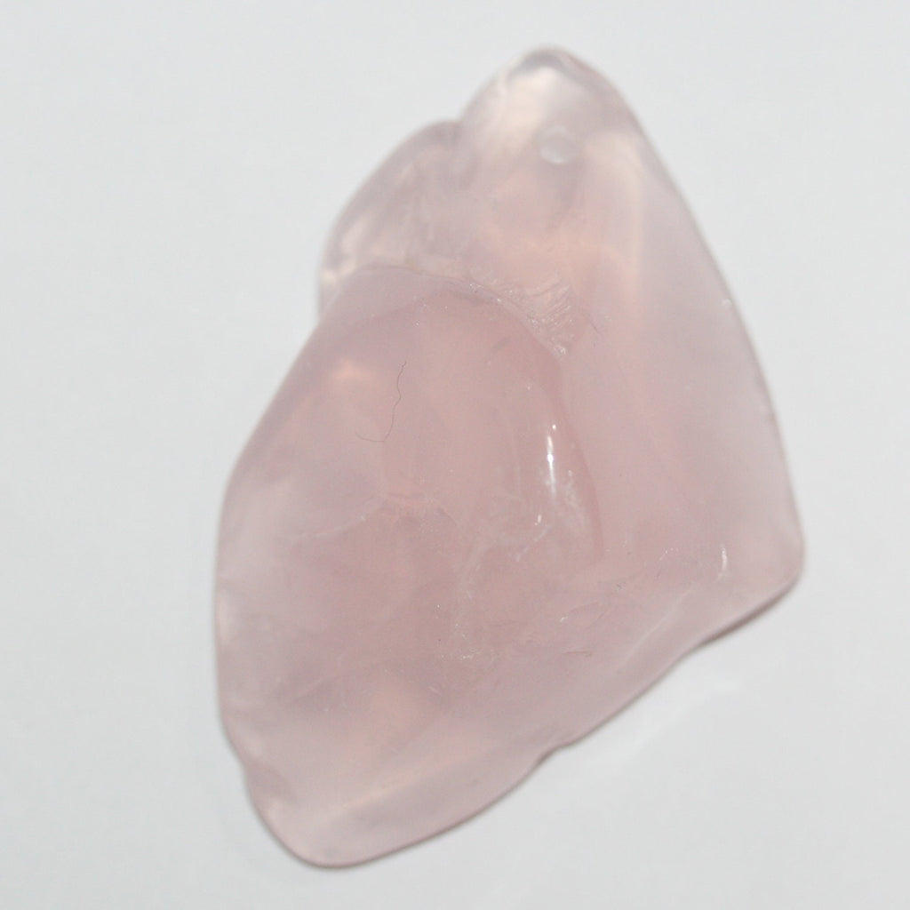 Pendentif irrégulier en quartz rose brut, environ 45 x 30 mm (1 pièce).