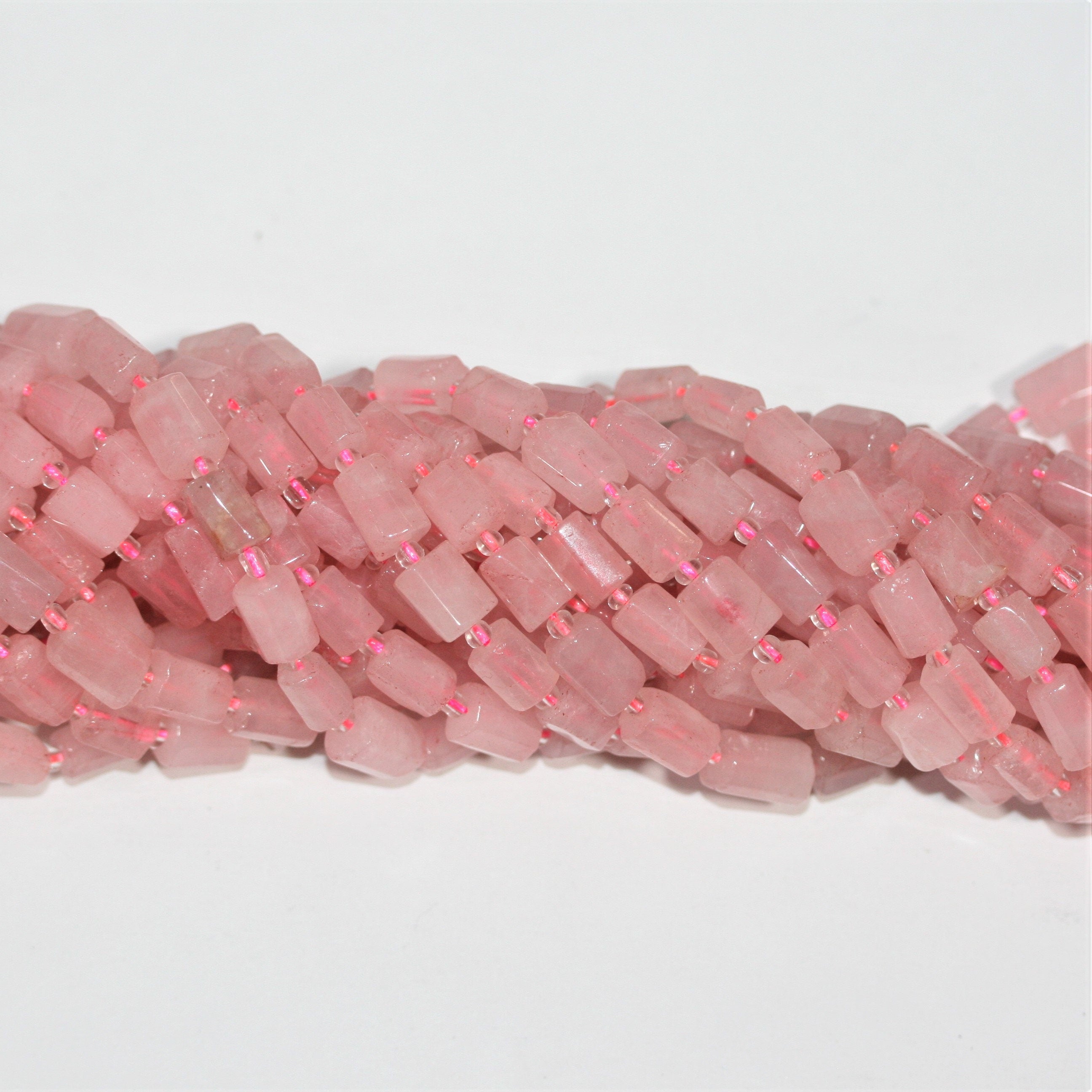 Cuentas de cuarzo rosa facetadas de 16" (10 x 7 mm). Longitud aproximada: 40 cm.