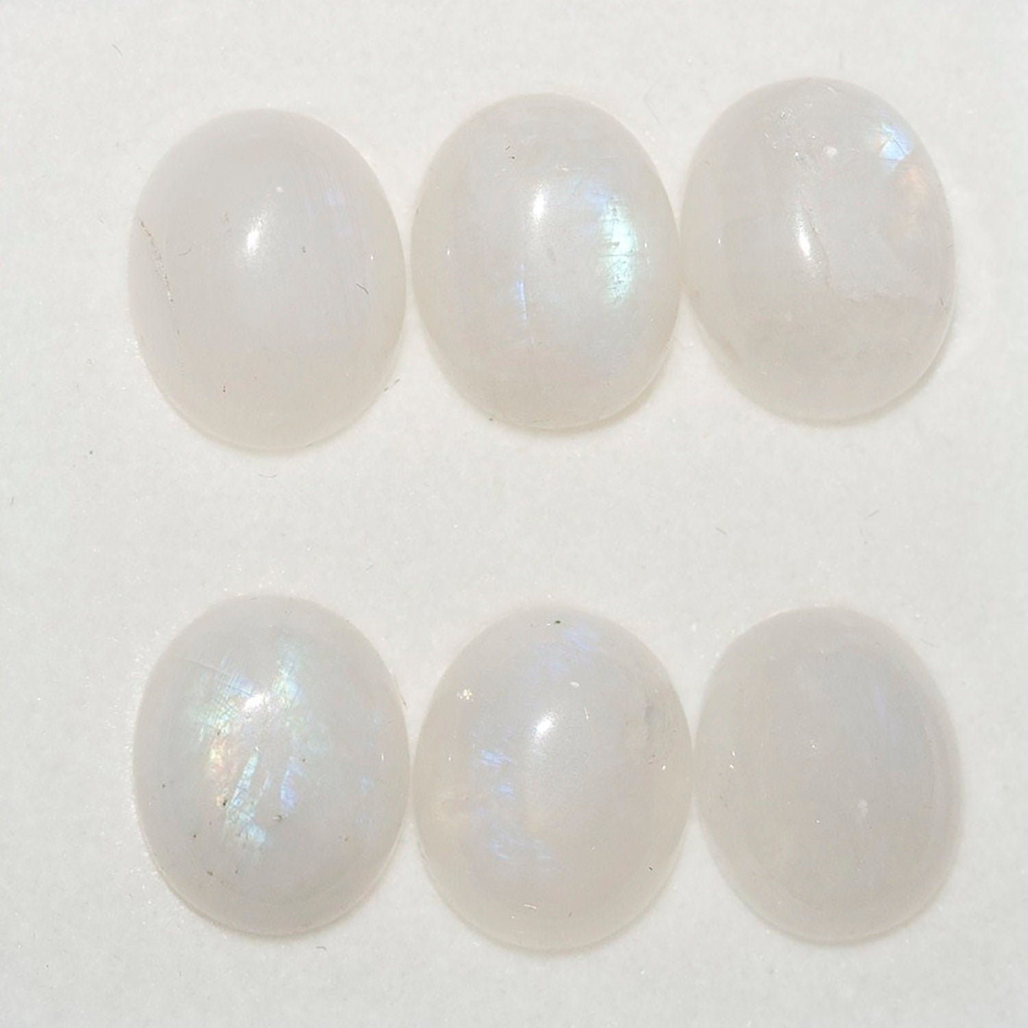 Lote de 6 cabujones ovalados de piedra lunar de 11 x 9 mm. (6 uds.)