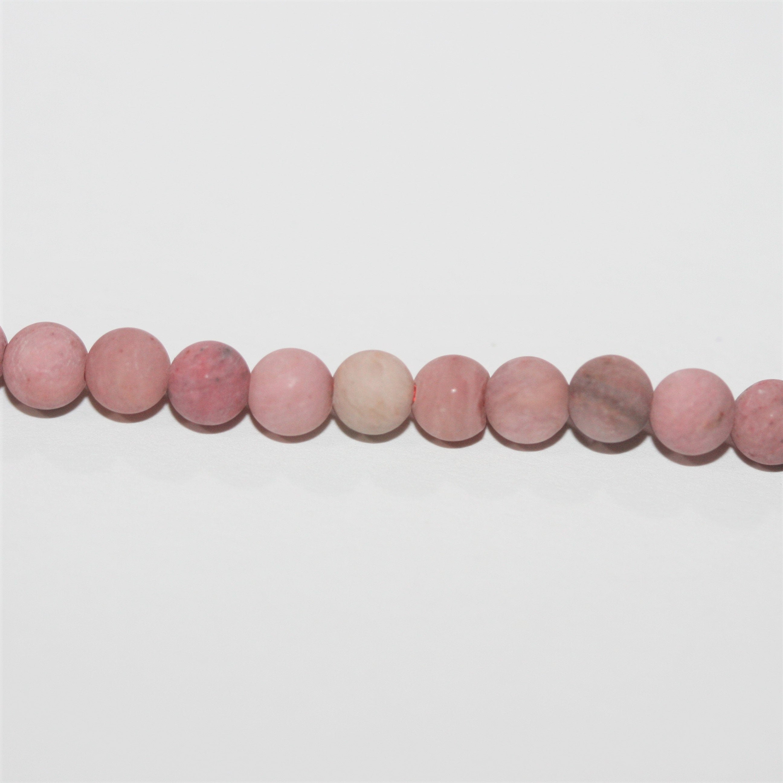 Perles rondes lisses en rhodonite, finition mate, 4 mm - Fil de 40 cm.