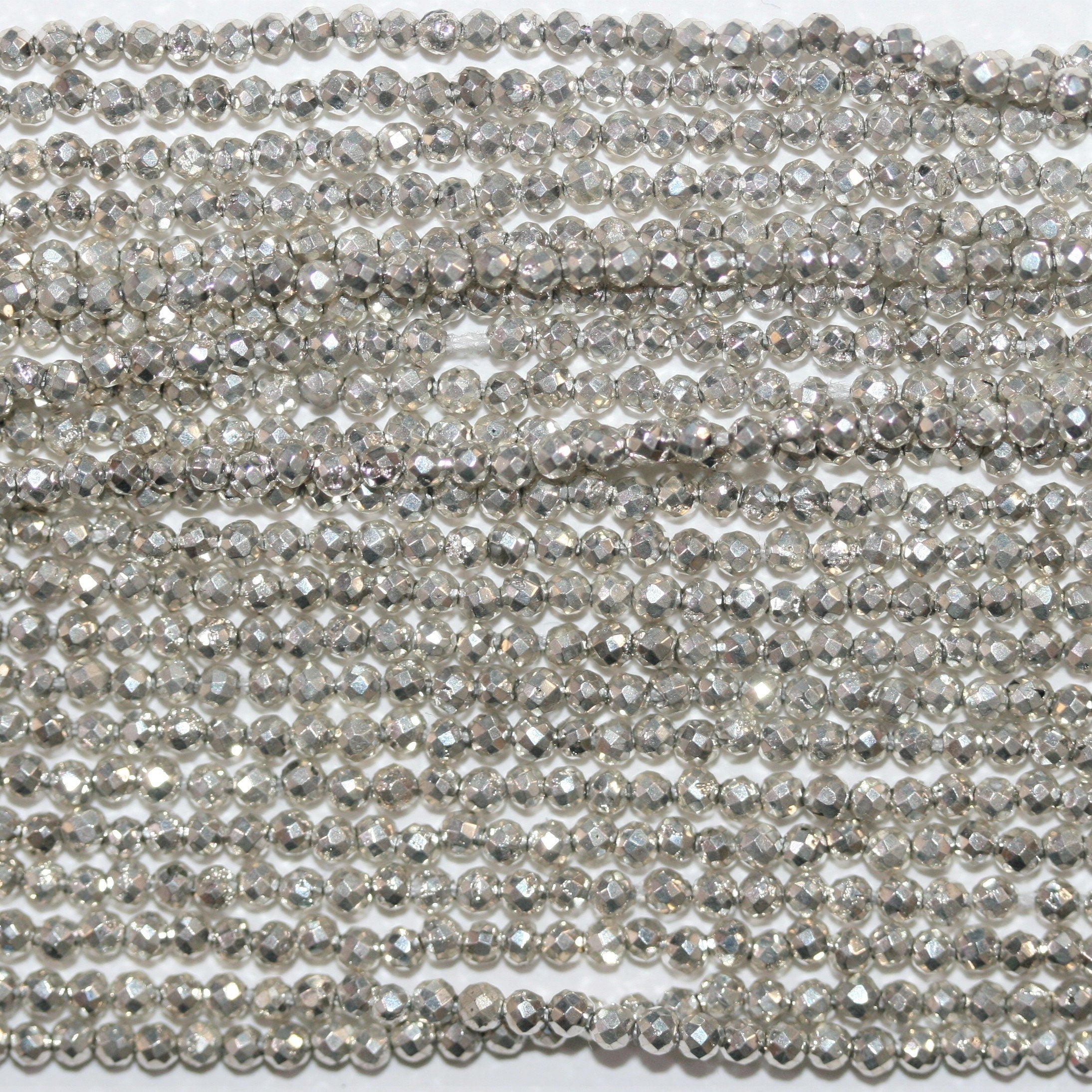 13" St. Silver Pyrite Faceted Round Beads 2mm.- Strand 34cm.