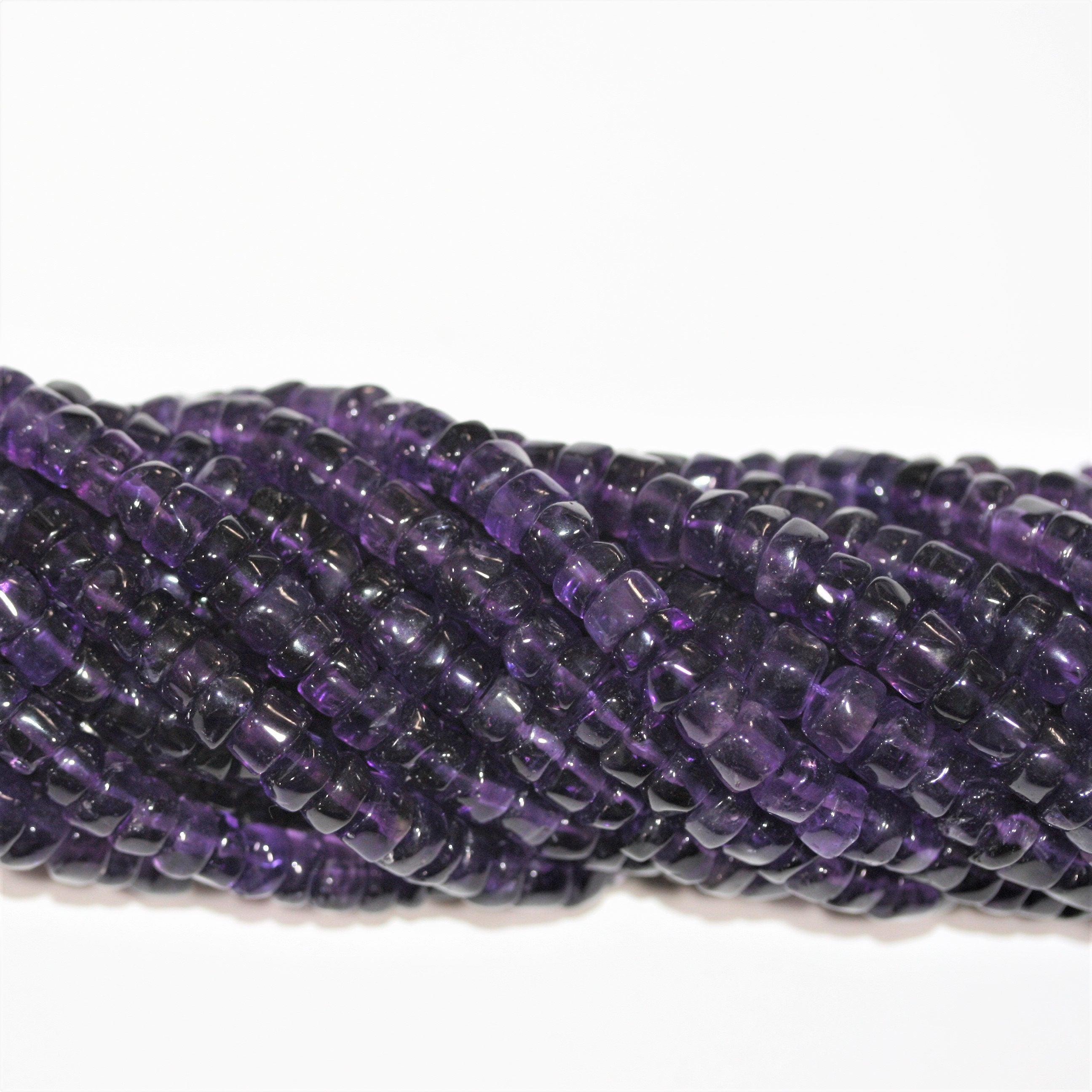 13" St Amethyst Smooth Disc Beads 6x3mm. Approx.- Strand 33cm.