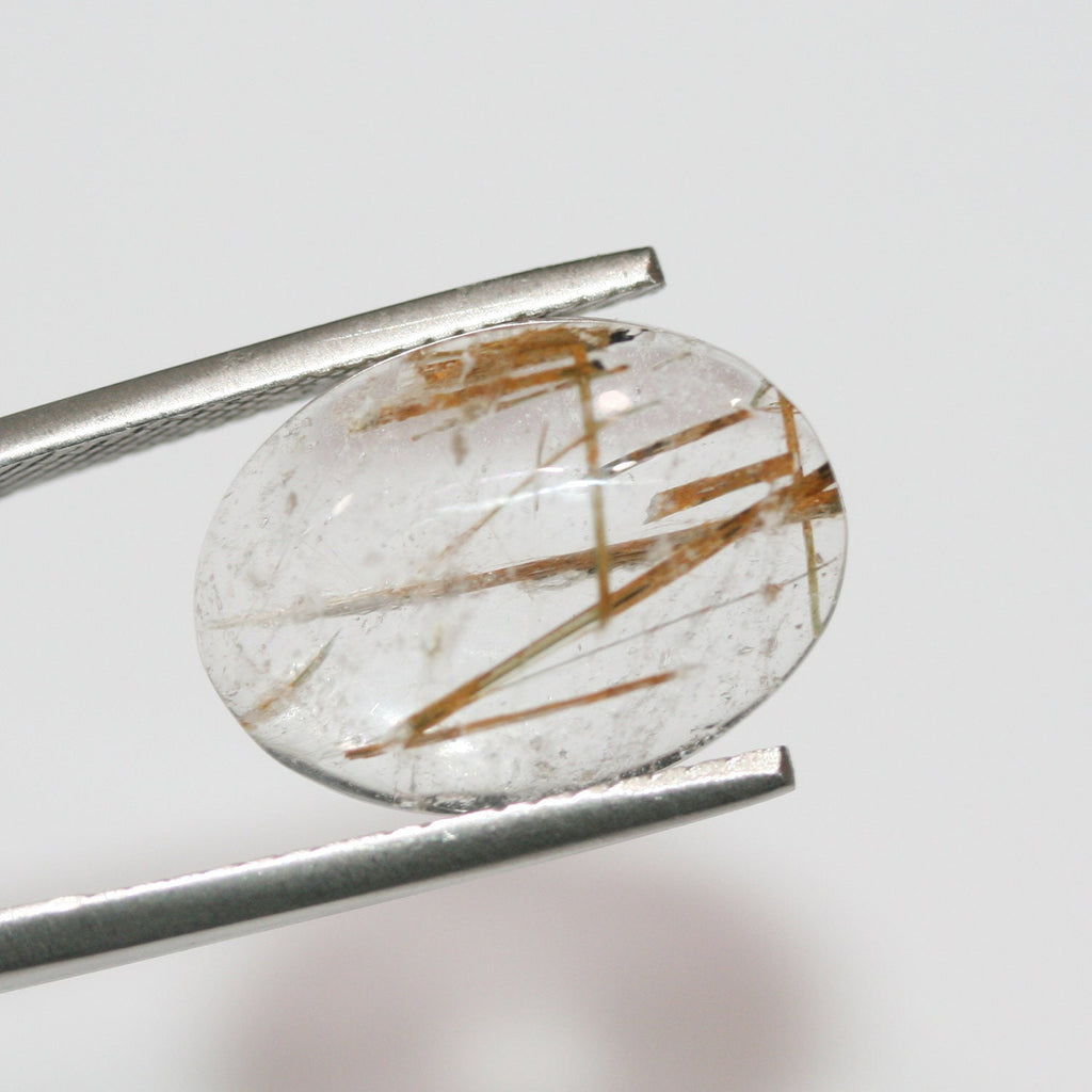 Lote de 4 cabujones ovalados de cuarzo rutilado de 14 x 10 mm. (4 uds.)