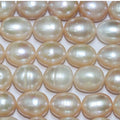 Perla ovalada color salmón de agua dulce de 16" (11-12 mm) - Hilo de 40 cm