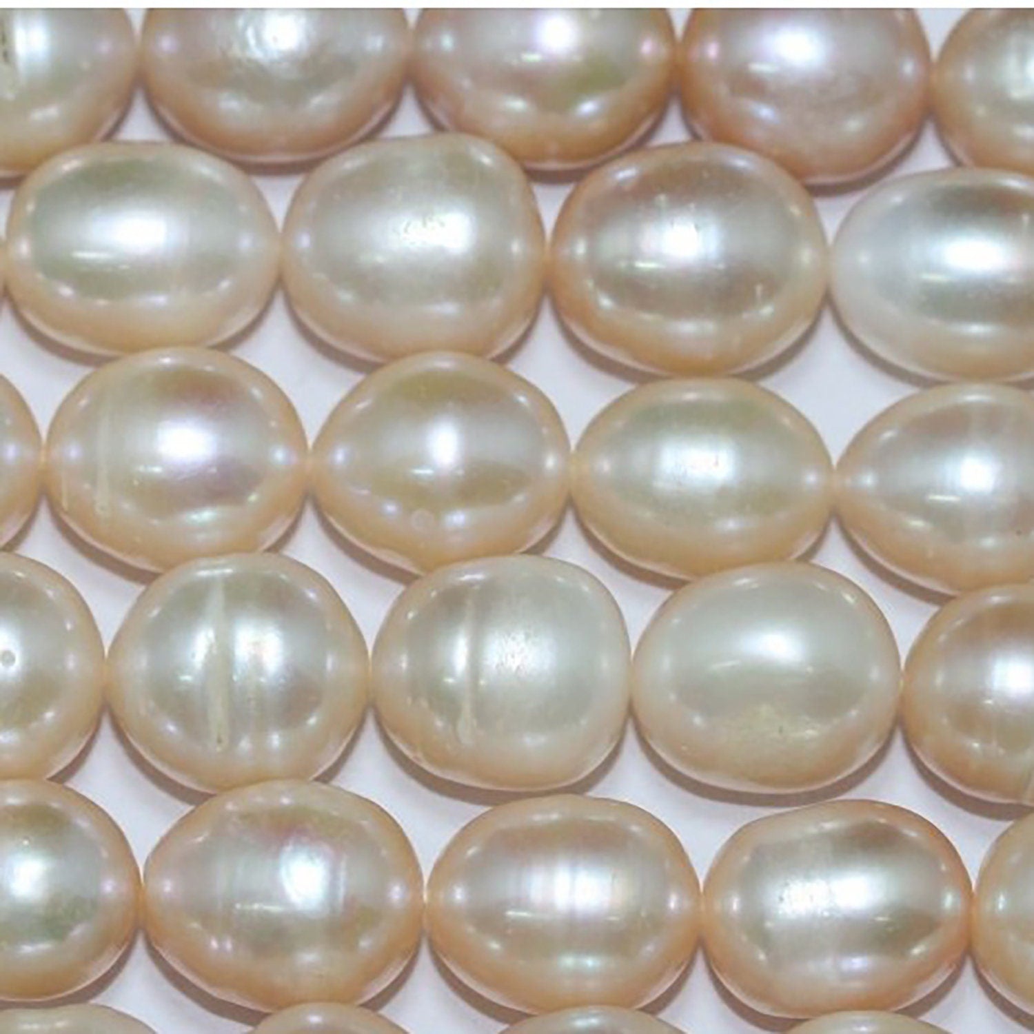 Perla ovalada color salmón de agua dulce de 16" (11-12 mm) - Hilo de 40 cm