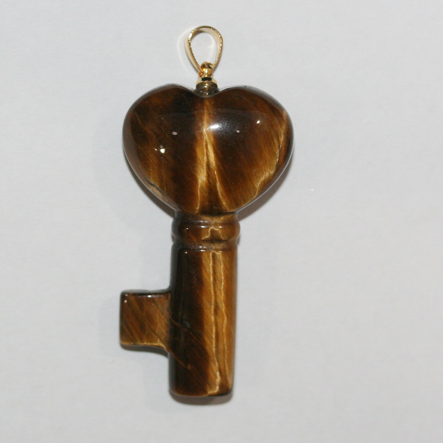 Pendentif clé œil de tigre lisse 40x22mm.