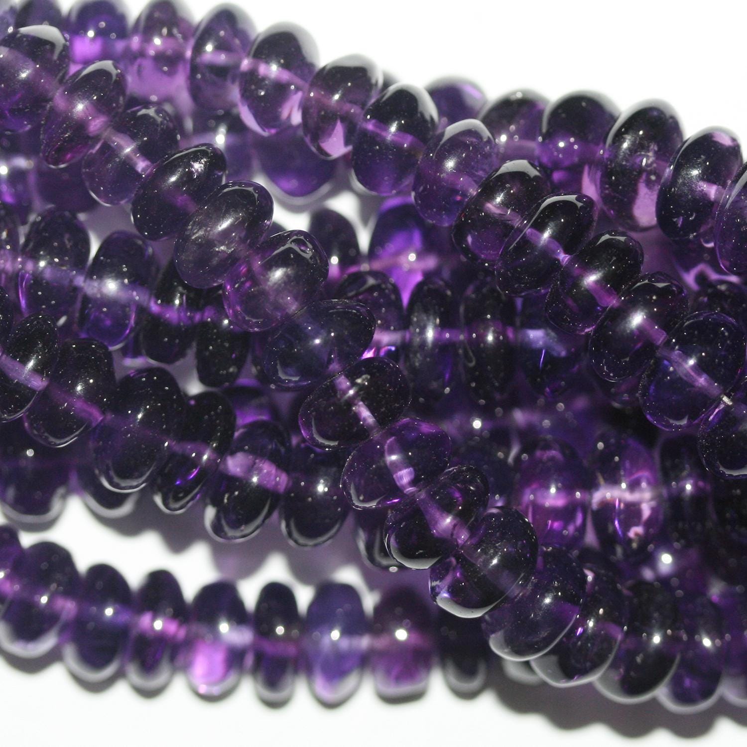 Cuentas redondas lisas de amatista de 16" (8 x 5-11 x 7 mm) graduadas. Longitud aproximada: 40 cm.