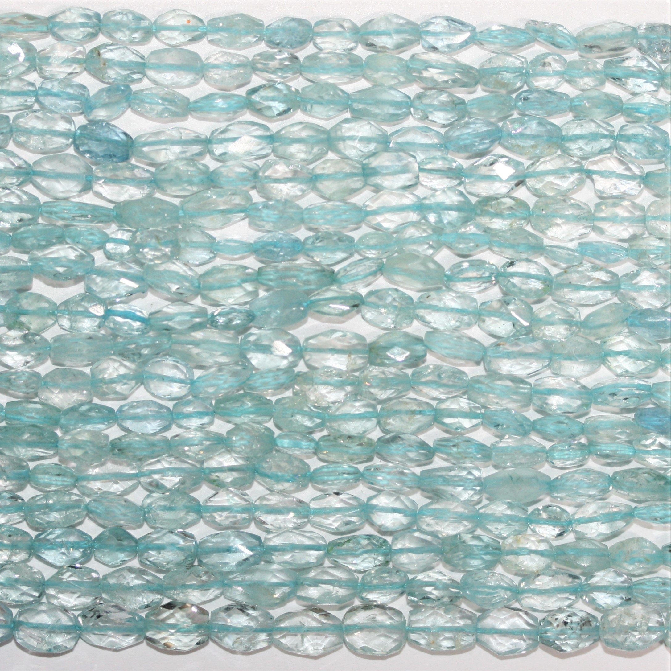 13" St Aquamarine Faceted Oval Beads 6x4mm.-Strand 34cm.