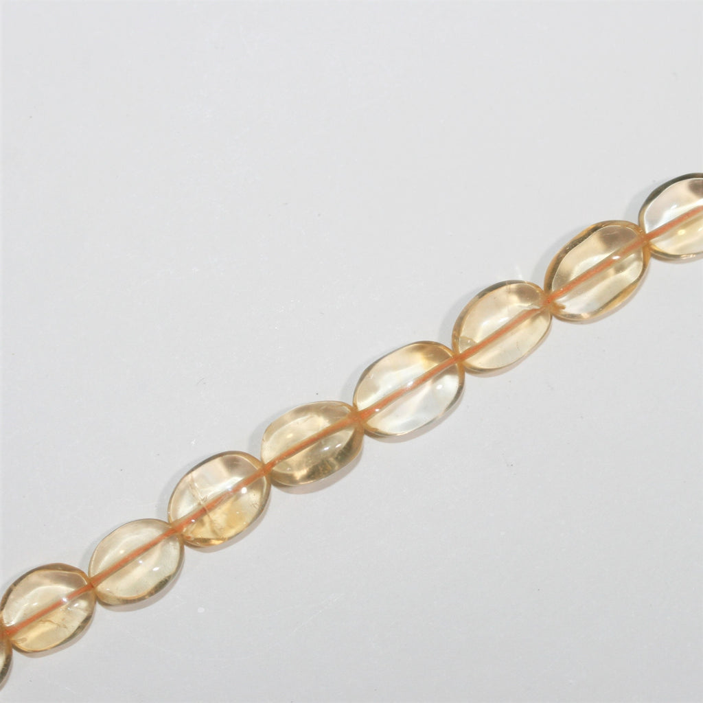 Perles ovales lisses de citrine 10x8mm environ - Fil de 37cm.