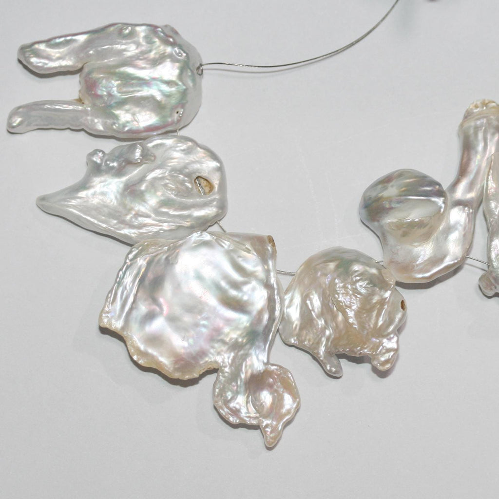 Perles Keshi d'eau douce de 40 cm (16 pouces), 26 x 18 mm environ. Longueur du fil : 40 cm environ. Perles naturelles à prix de gros.