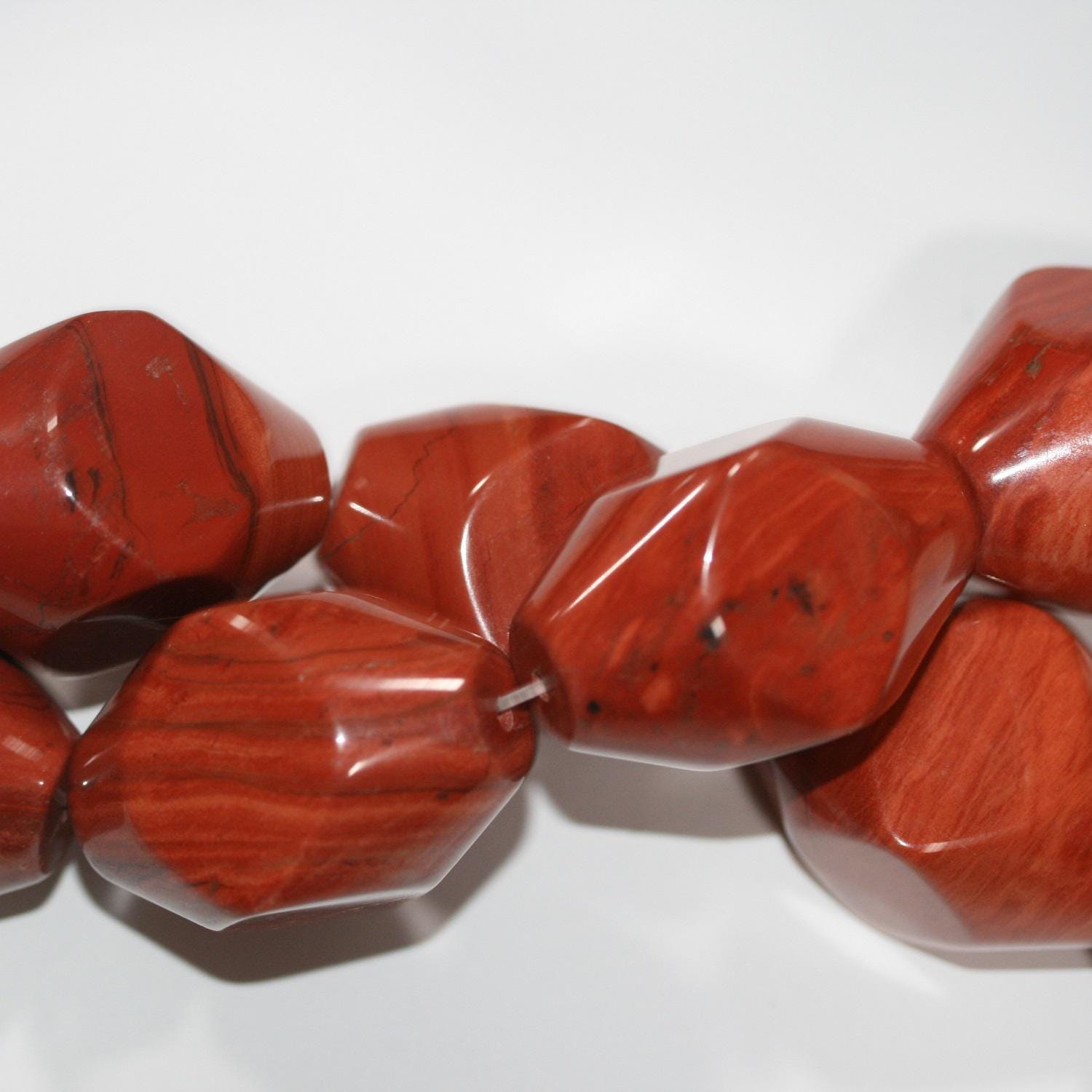 12" St Red Jasper Barrel Faceted Beads 40x25mm.-Strand 36cm