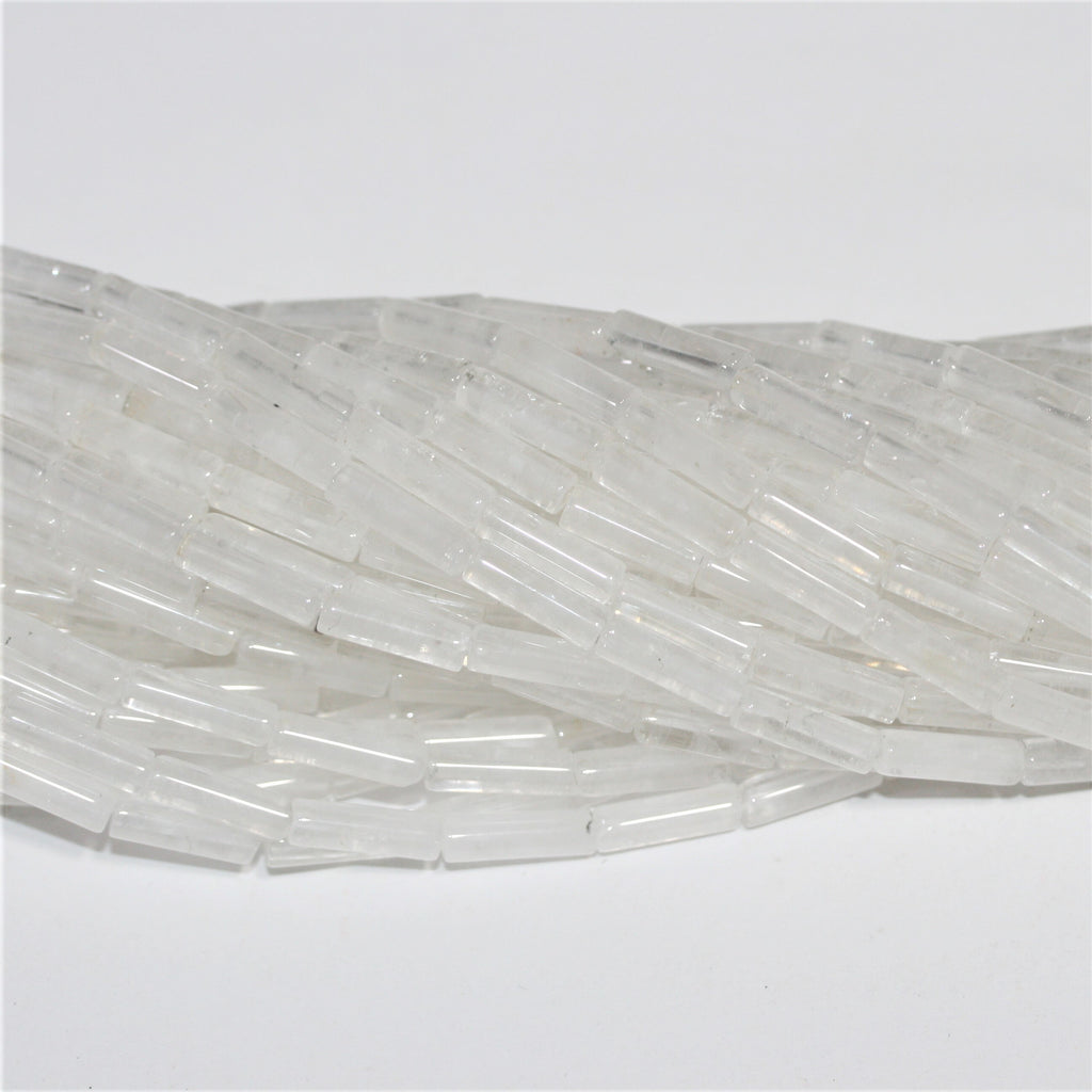 Perles tubulaires lisses en cristal de roche de 15 pouces, 13 x 4 mm. - Brin de 39 cm.