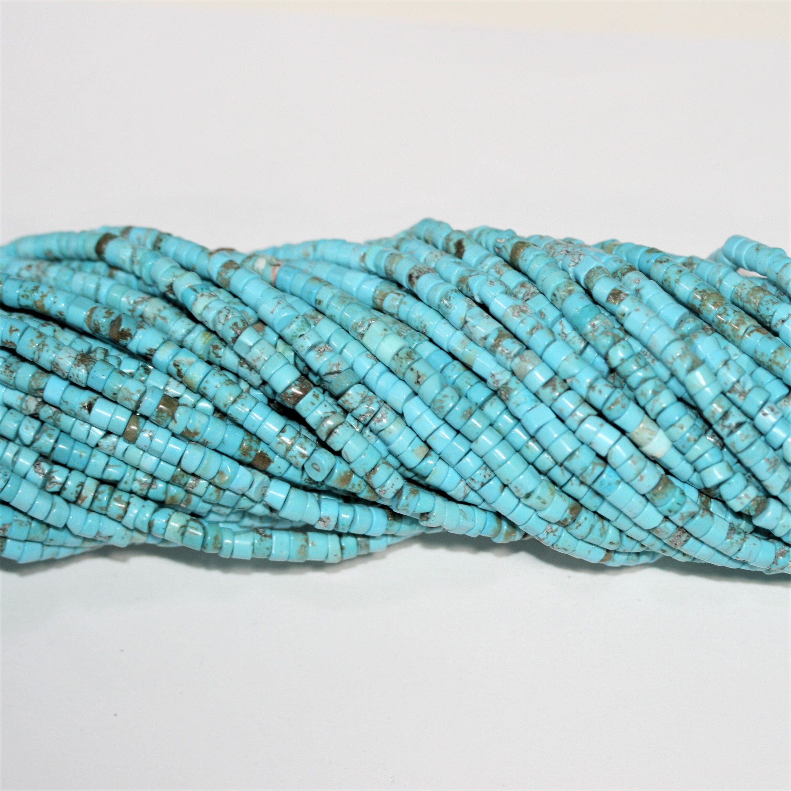 Perles rondelles lisses en turquoise St. 15" 4x2mm.- Brin 39cm.