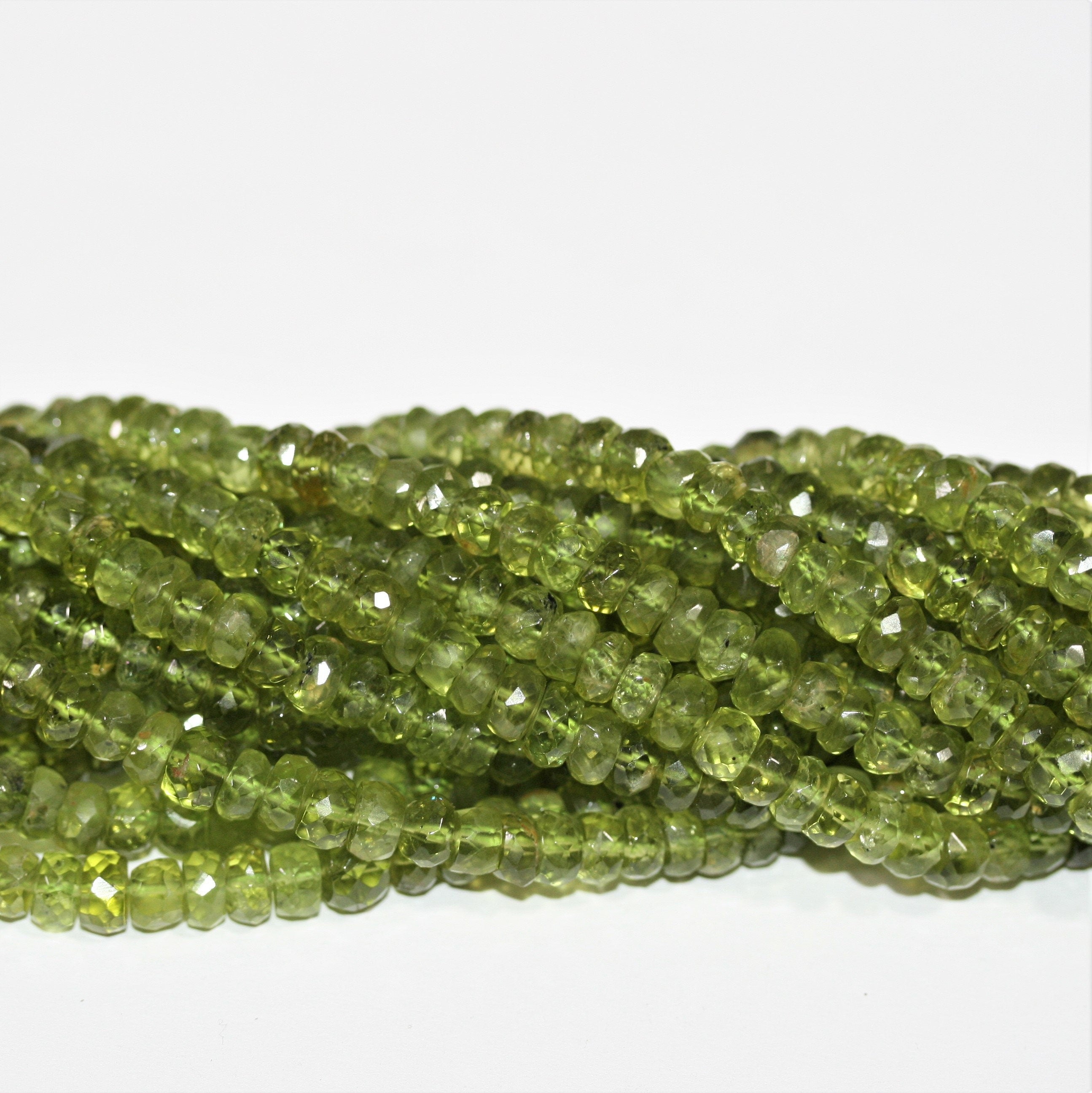 13" St Peridot Faceted Rondelle Beads 6x3.5mm.-Strand 33cm.