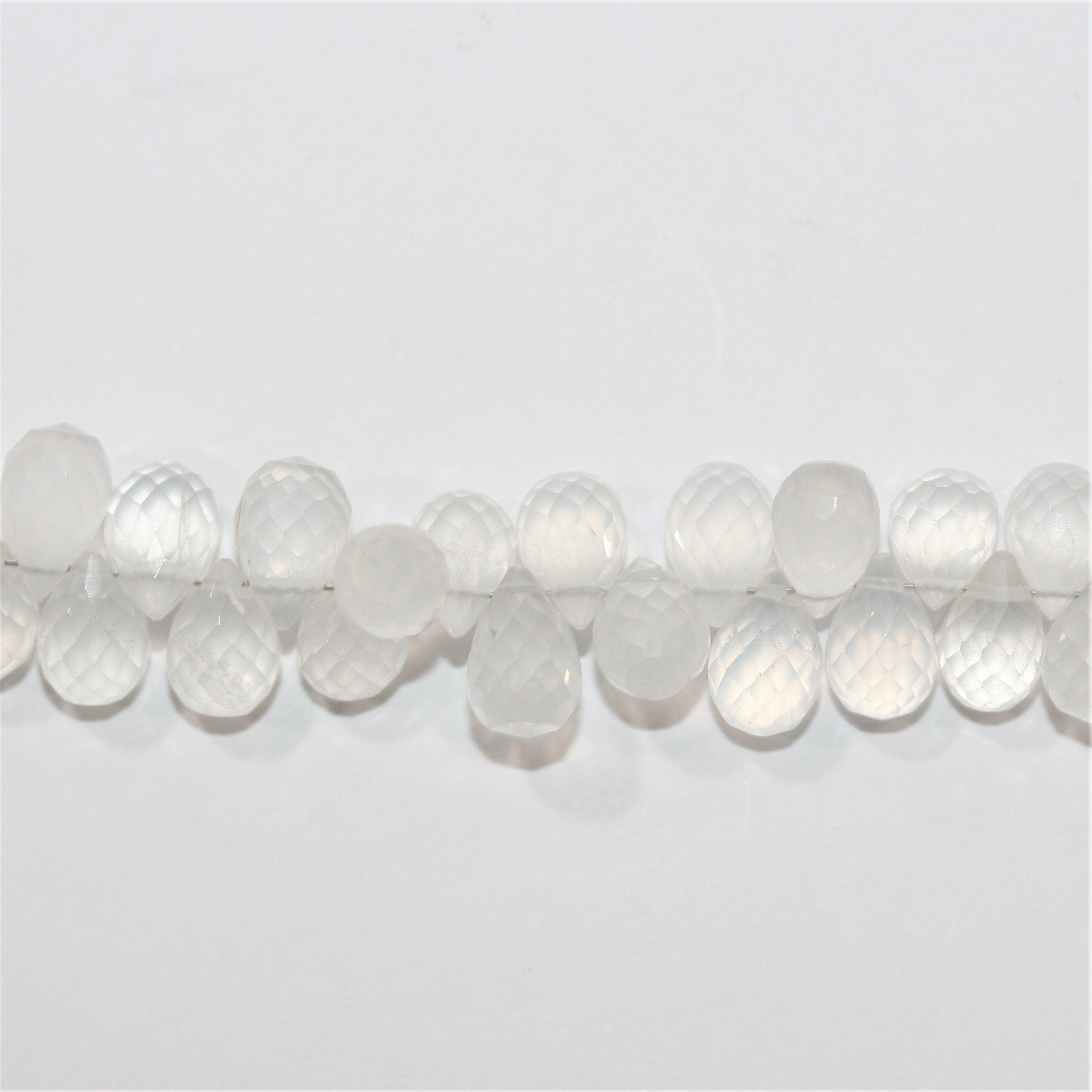 Perles en cristal de roche St 8" à facettes en forme de goutte, 9 x 6 mm - Fil de 20 cm.