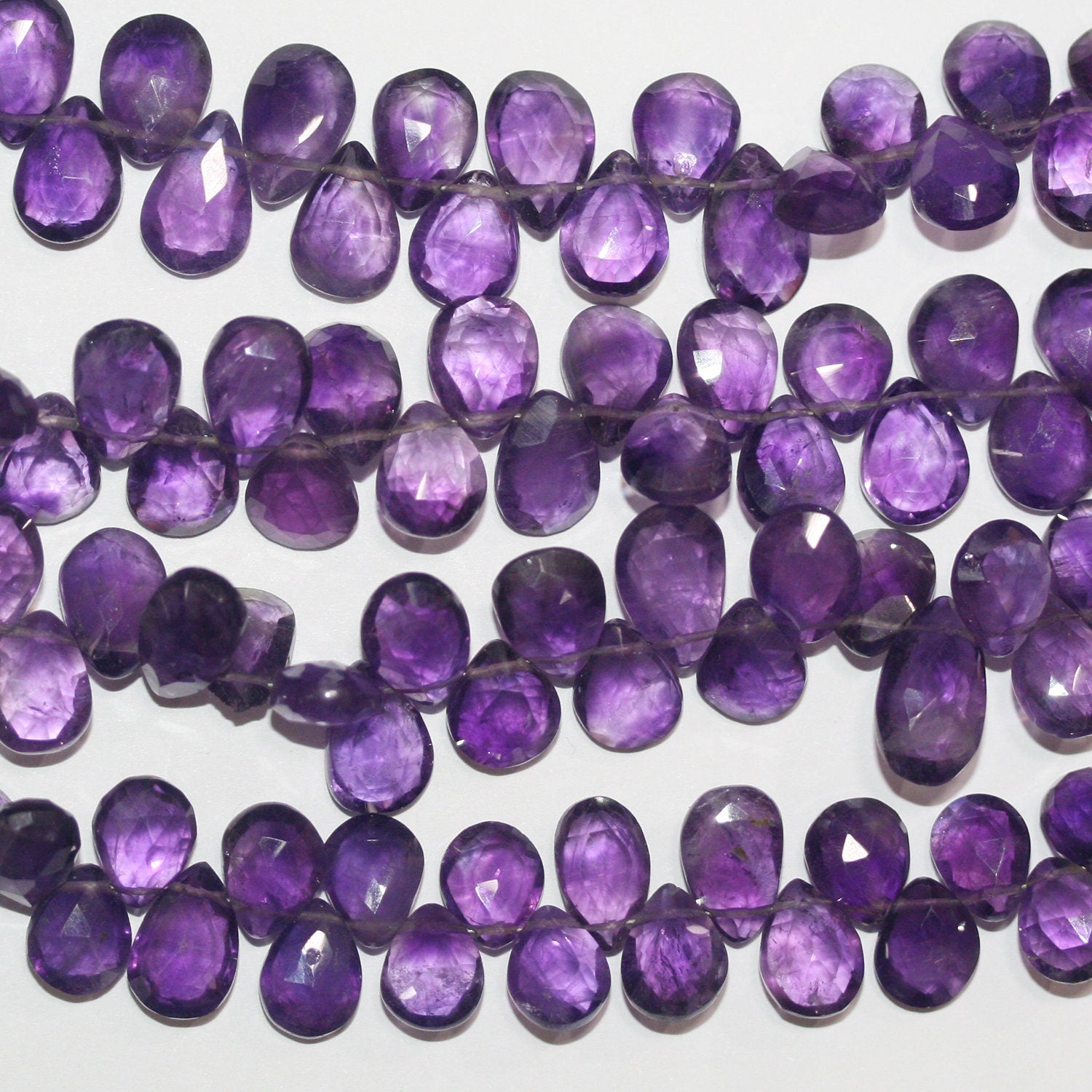 Cuentas de amatista facetadas de 8" x 12 x 9 mm (aprox.), hilo de 20 mm.