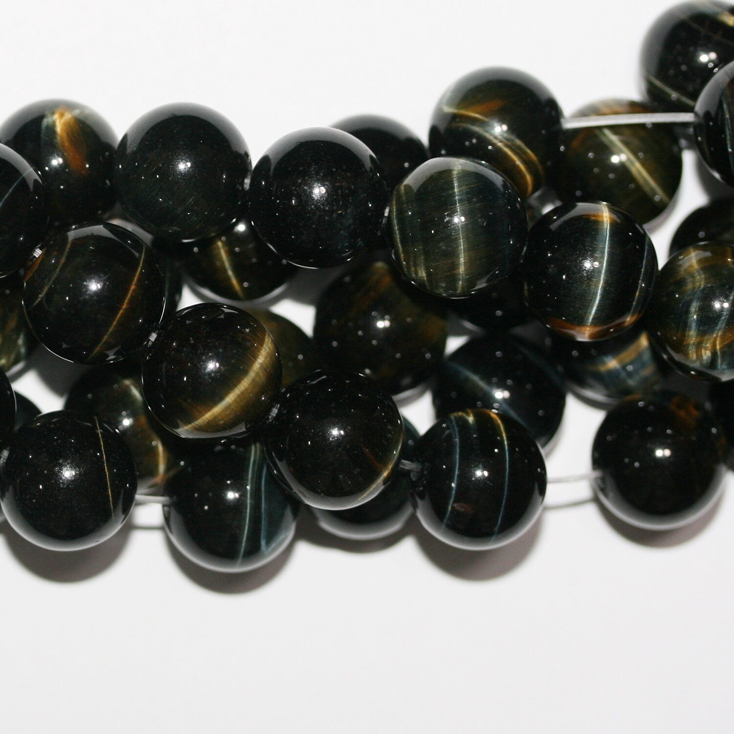 Perles rondes lisses œil de tigre St 15" 14 mm.-Rig 39 cm.