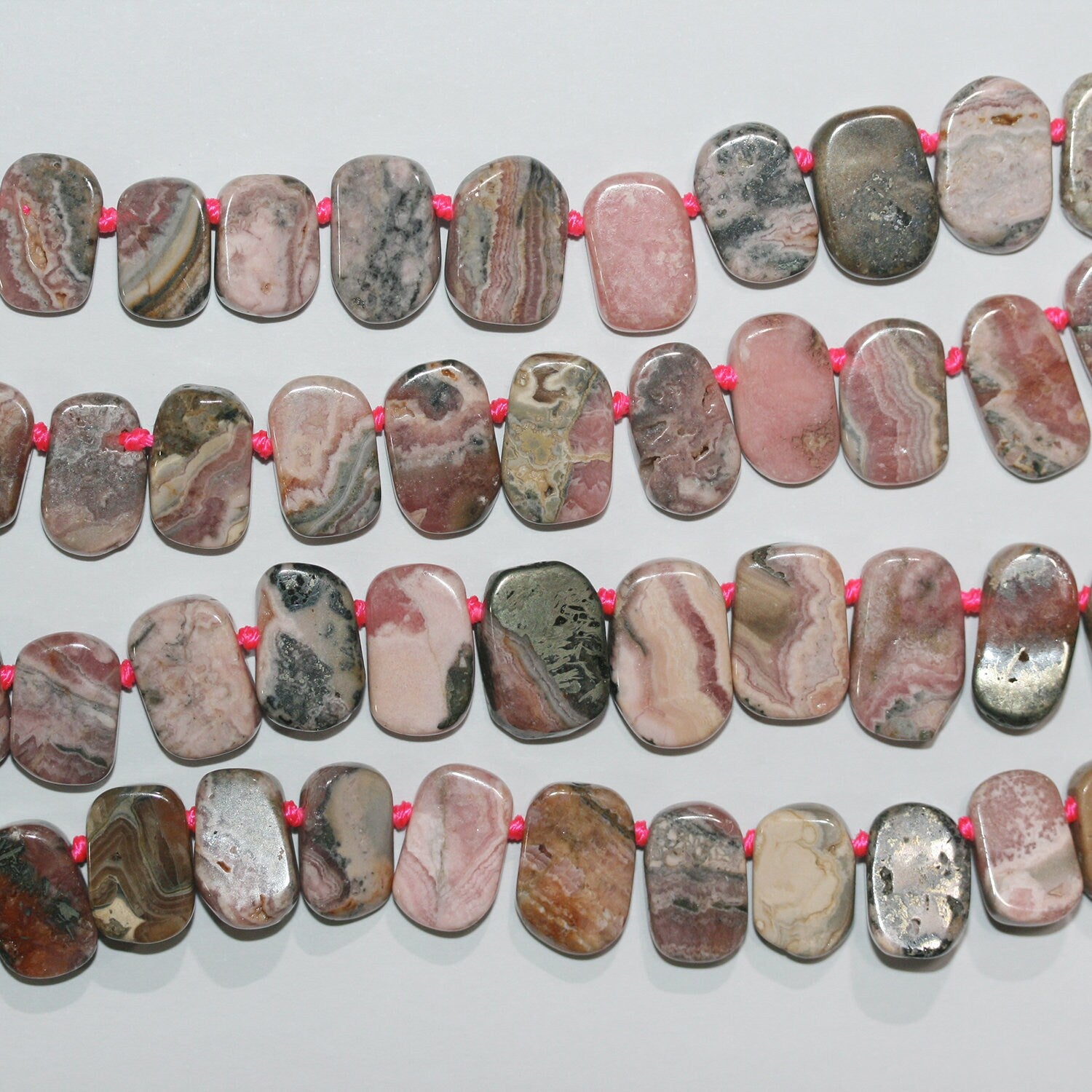 Cuentas ovaladas lisas graduadas de rodocrosita de 16", 10 x 6-17 x 11 mm, aprox. - Hilo de 40 cm.