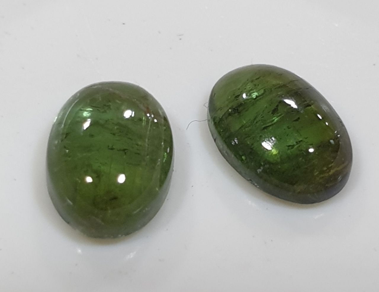 Green Tourmaline Pair Oval Cabochons 7x5mm.-(2pcs)
