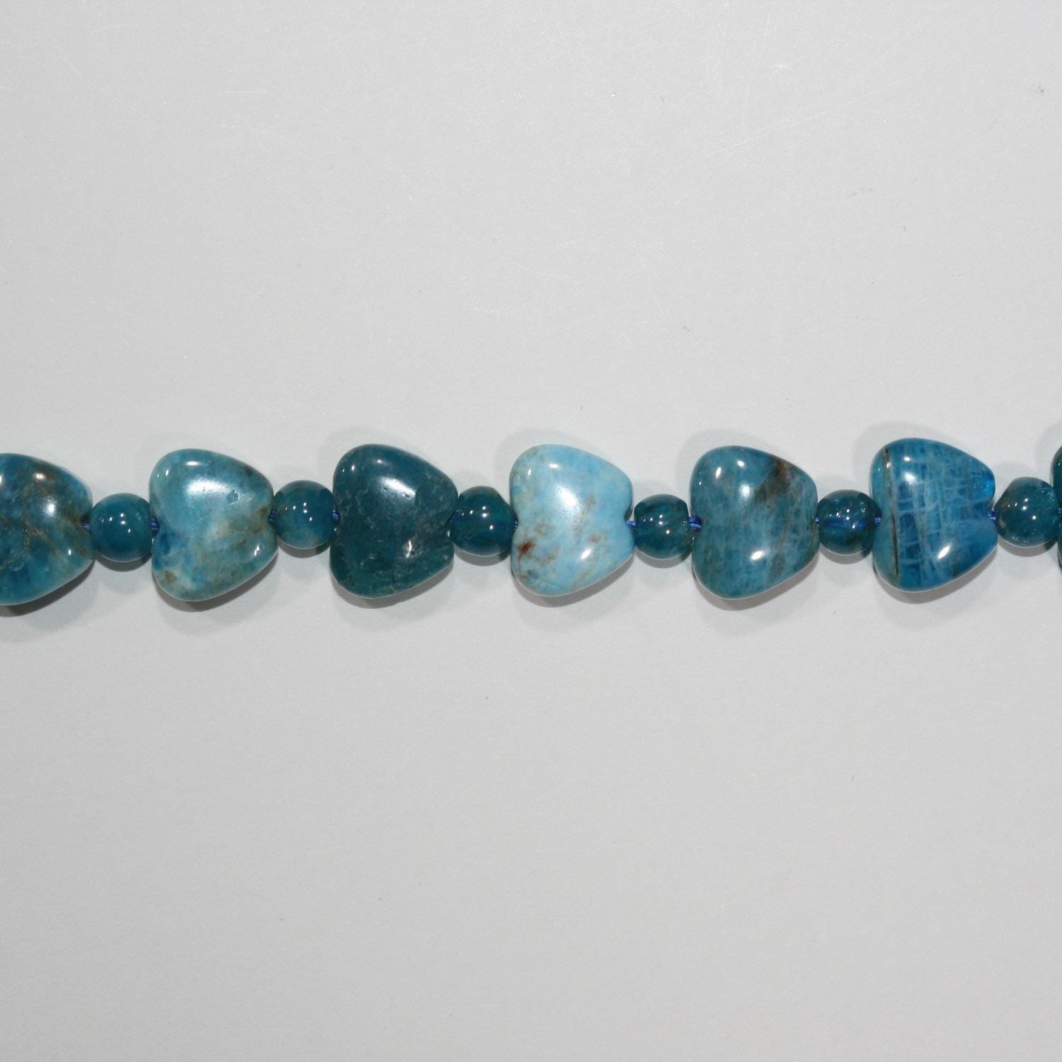15" St Perles de cœur lisses en apatite bleue 8x10mm.-Rig 39cm.