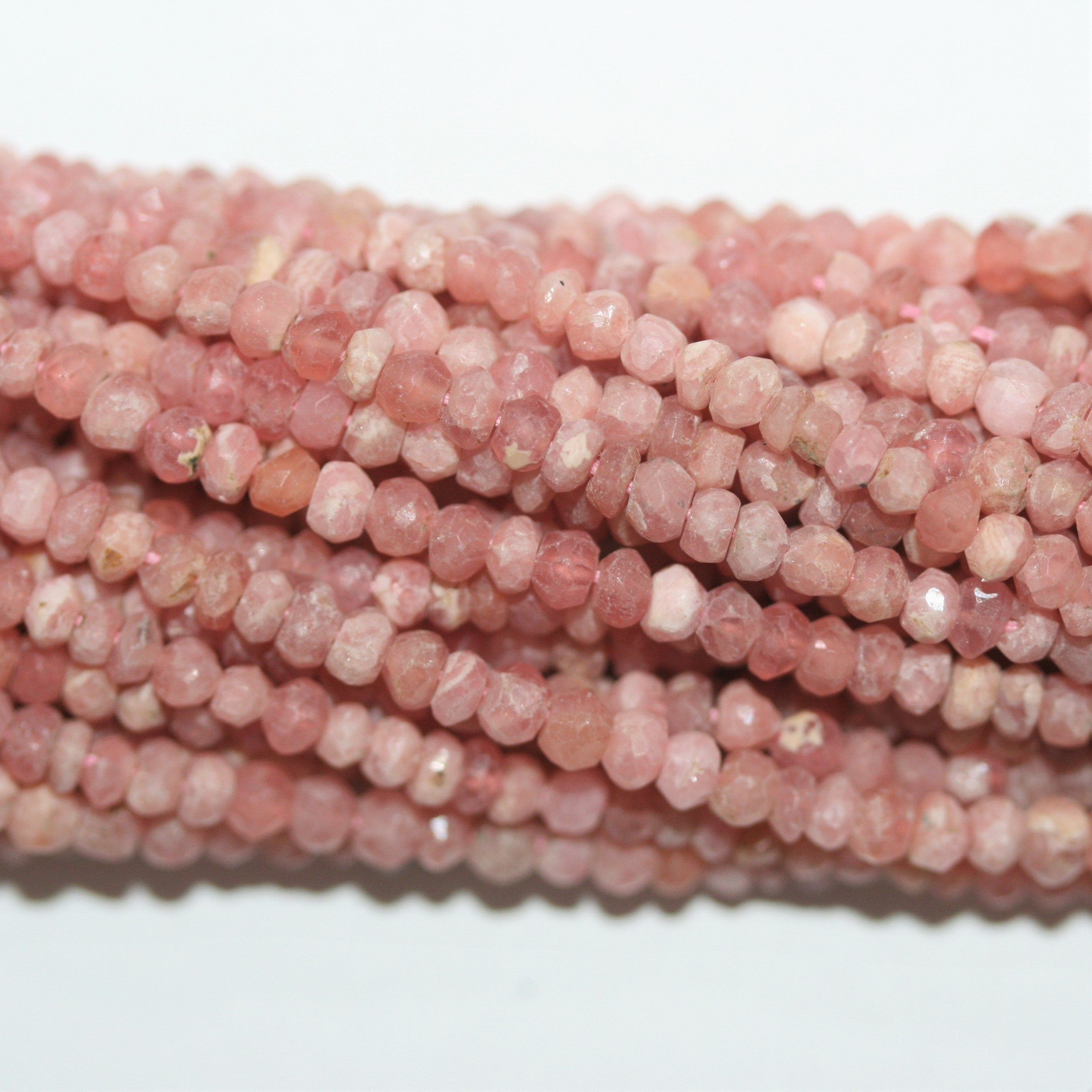 13" St Rhodochosite Faceted Rondelle Beads 3.5x2mm.-Strand 34cm.