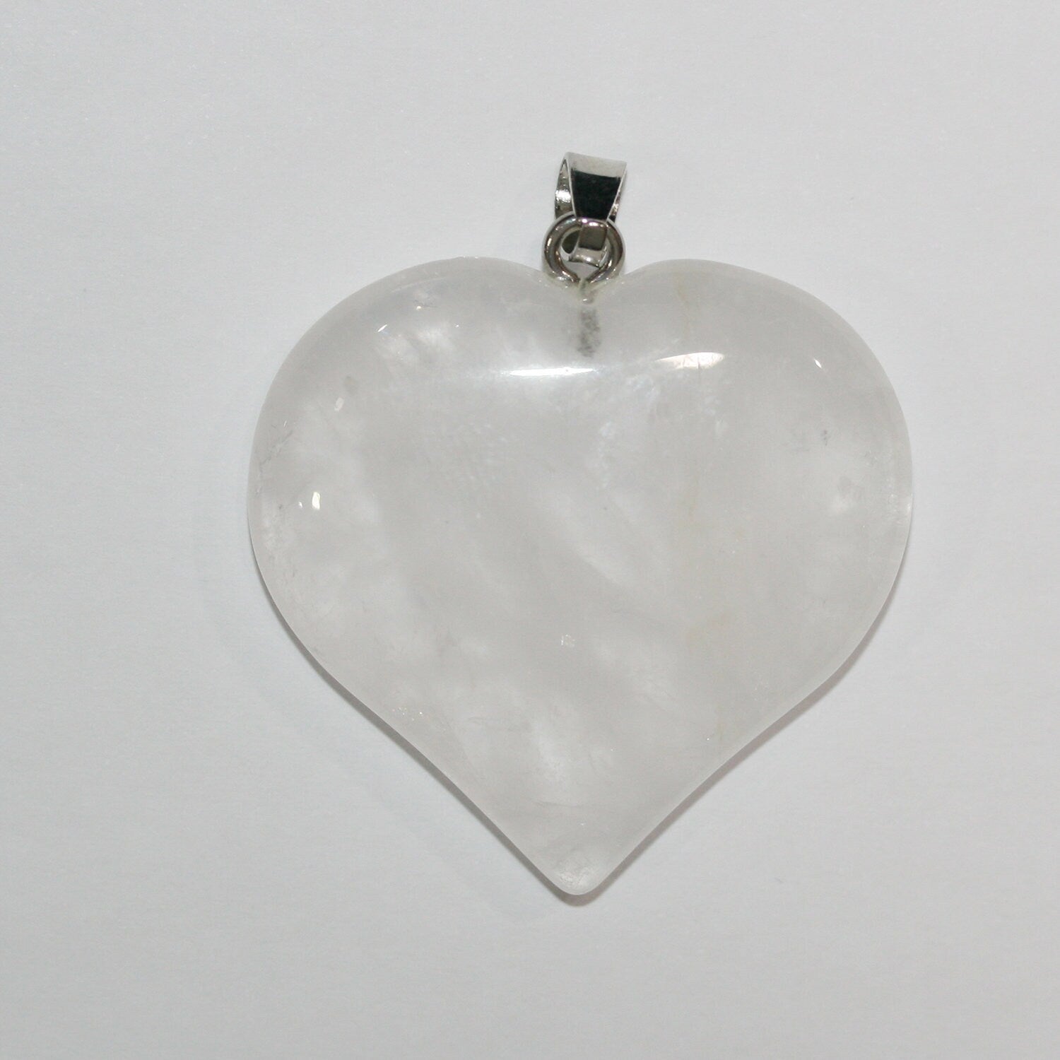 Pendentif cœur lisse en quartz cristal de roche 40 mm.