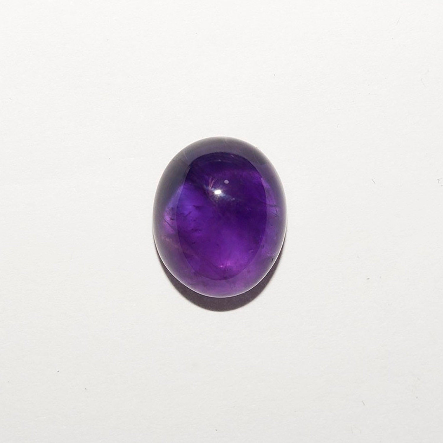 Lote de 4 cabujones ovalados de amatista de 12 x 10 mm. (4 uds.)