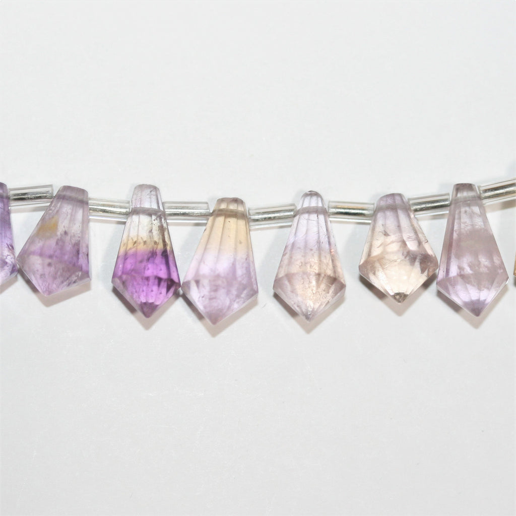 Cuentas facetadas de amatista de 5", 13 x 7 mm. Longitud aproximada: 14 cm.