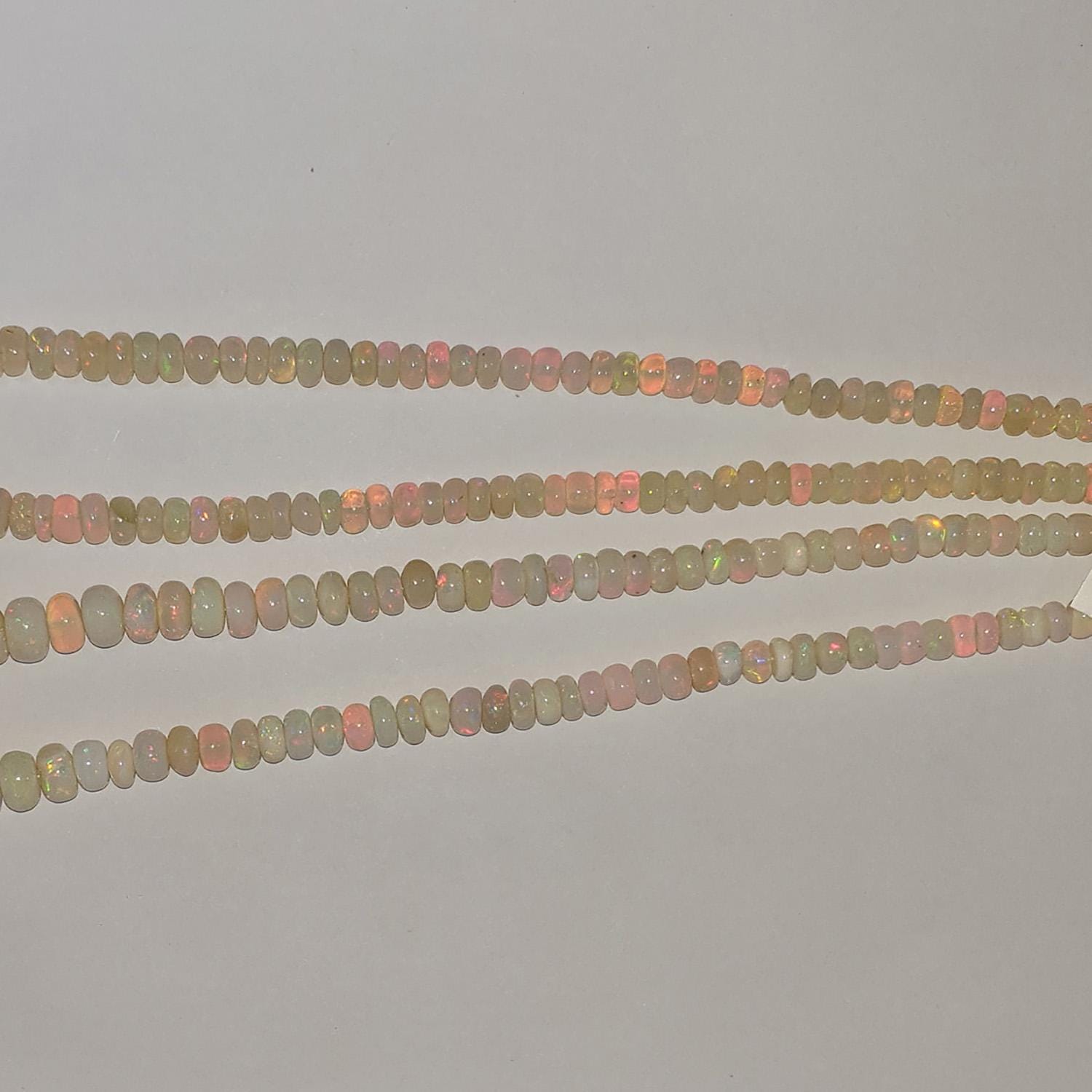 Perles rondelles lisses dégradées en opale éthiopienne St, 16 pouces (40,6 cm), 5 x 2 à 9 x 6 mm environ. Longueur du fil : 42 cm.