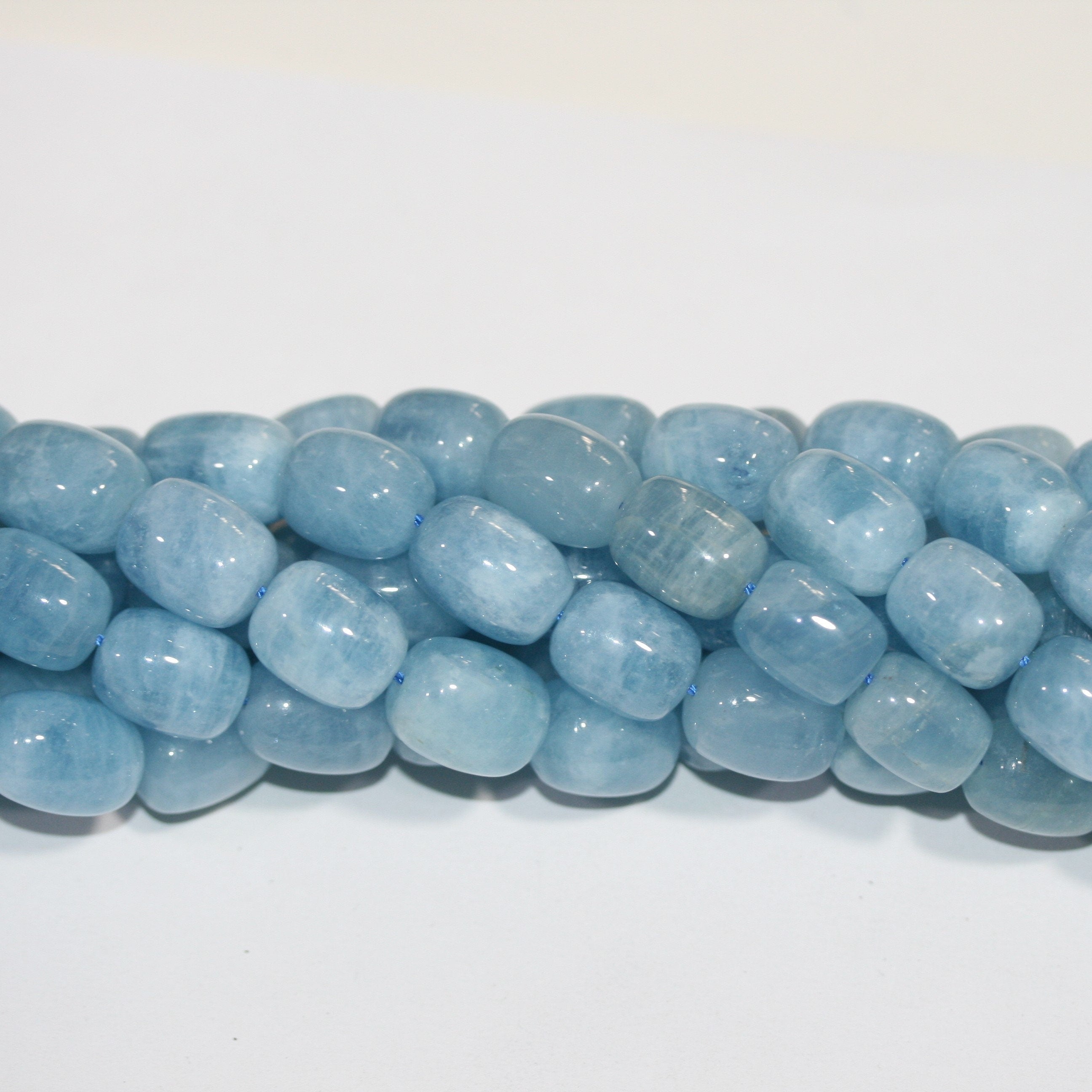 Cuentas de aguamarina lisas de 16" (16 x 12 mm). Longitud aproximada: 40 cm.