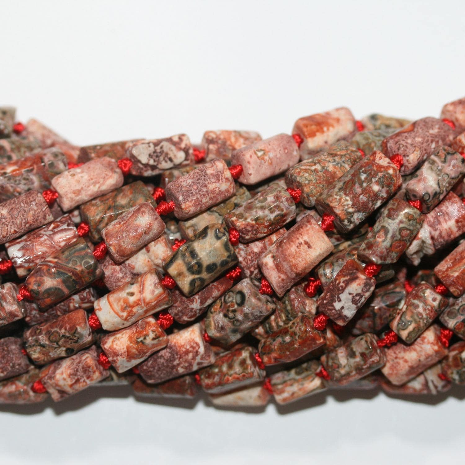 Jaspe léopard lisse en forme de tonneau de 14 pouces (14 x 8 mm). Filetage approximatif : 38 cm. Réf. 14740